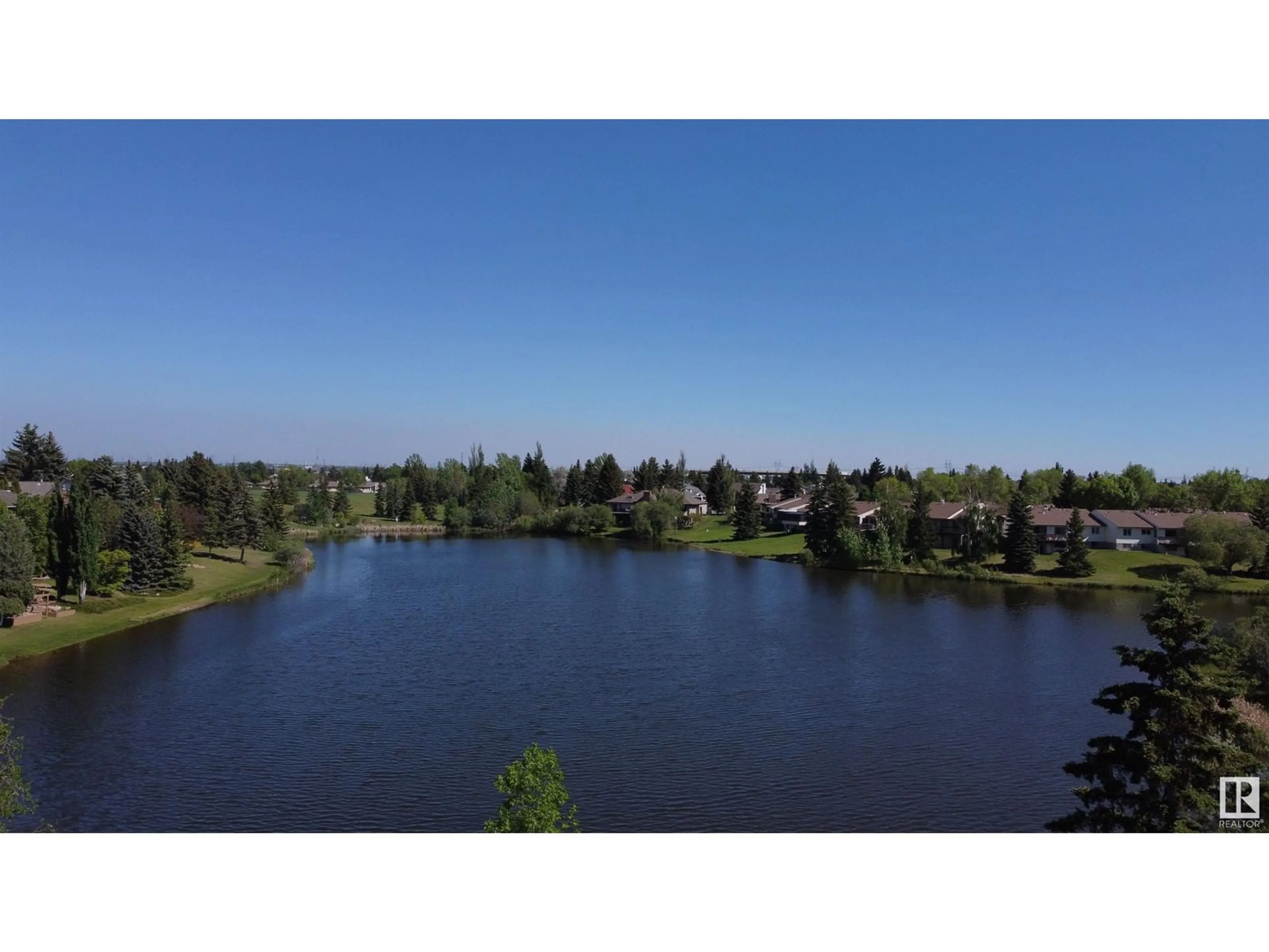 A pic from outside/outdoor area/front of a property/back of a property/a pic from drone, water/lake/river/ocean view for 10552 16 AV, Edmonton Alberta T6J5H9