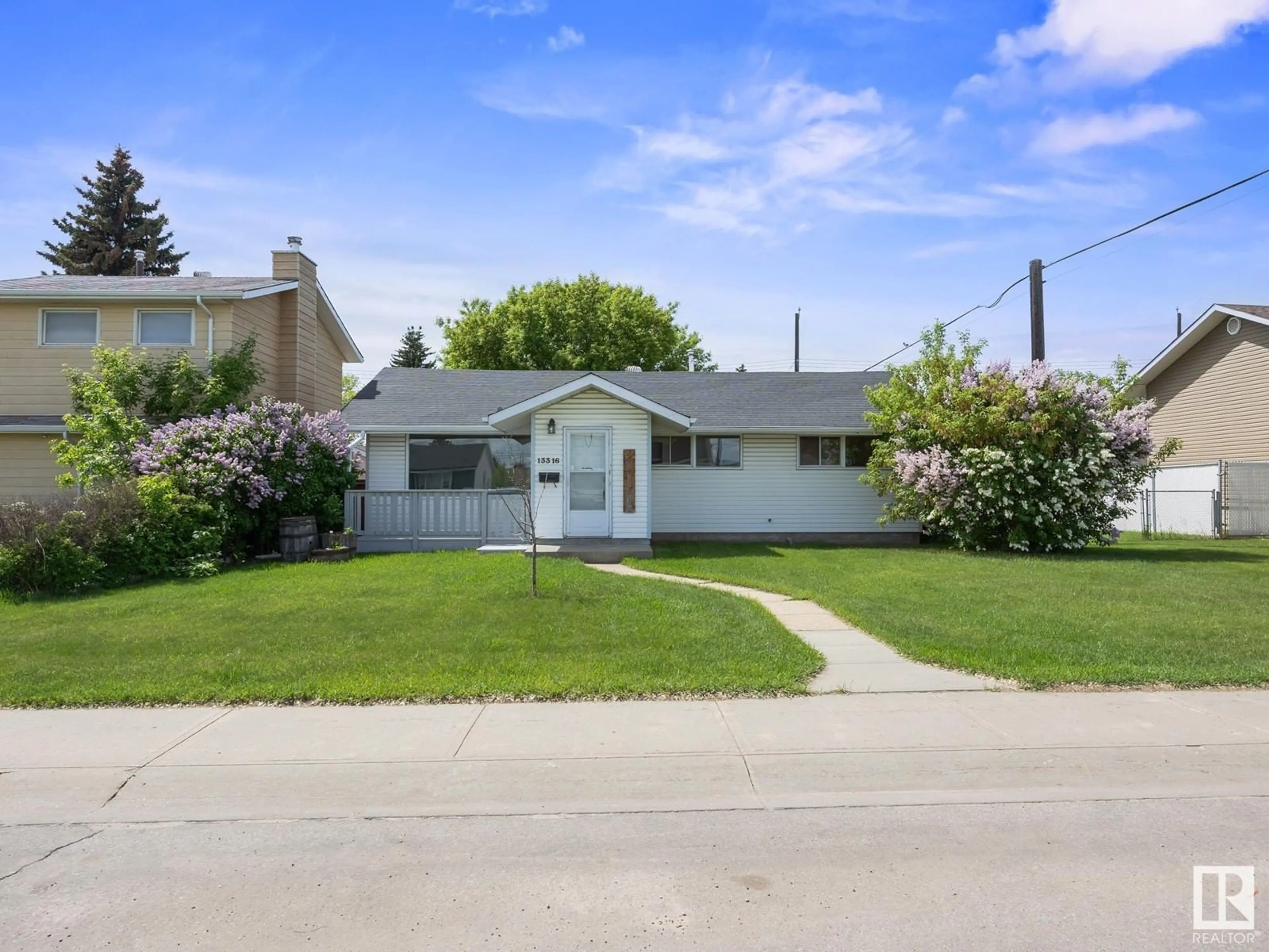 Home with vinyl exterior material, street for NW - 13316 135 ST, Edmonton Alberta T5L1V7