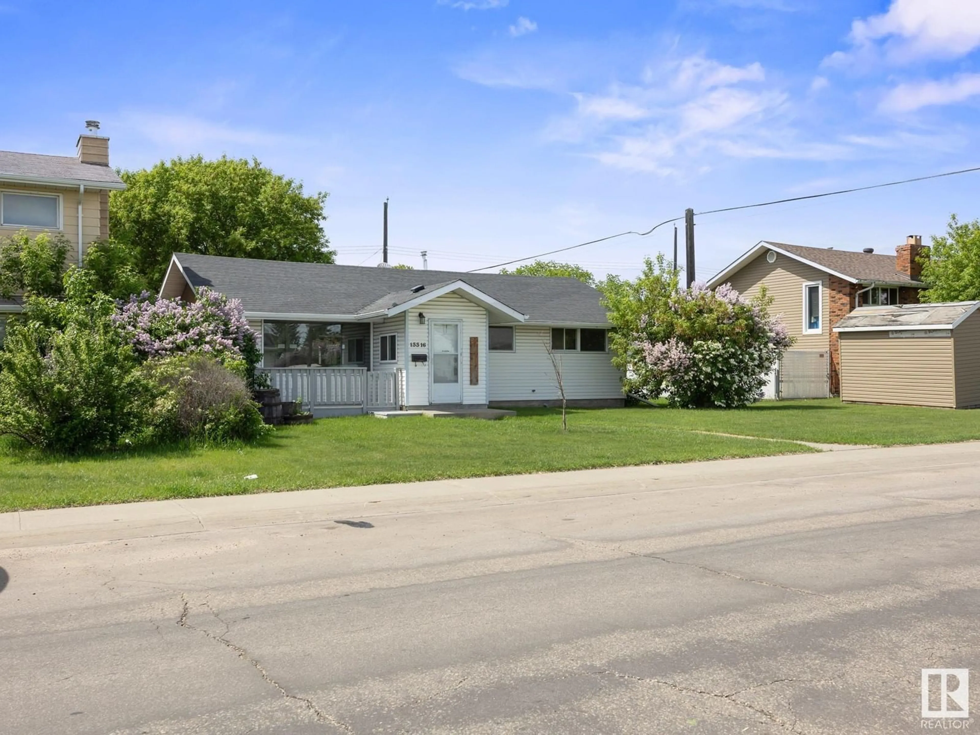 Home with vinyl exterior material, street for NW - 13316 135 ST, Edmonton Alberta T5L1V7