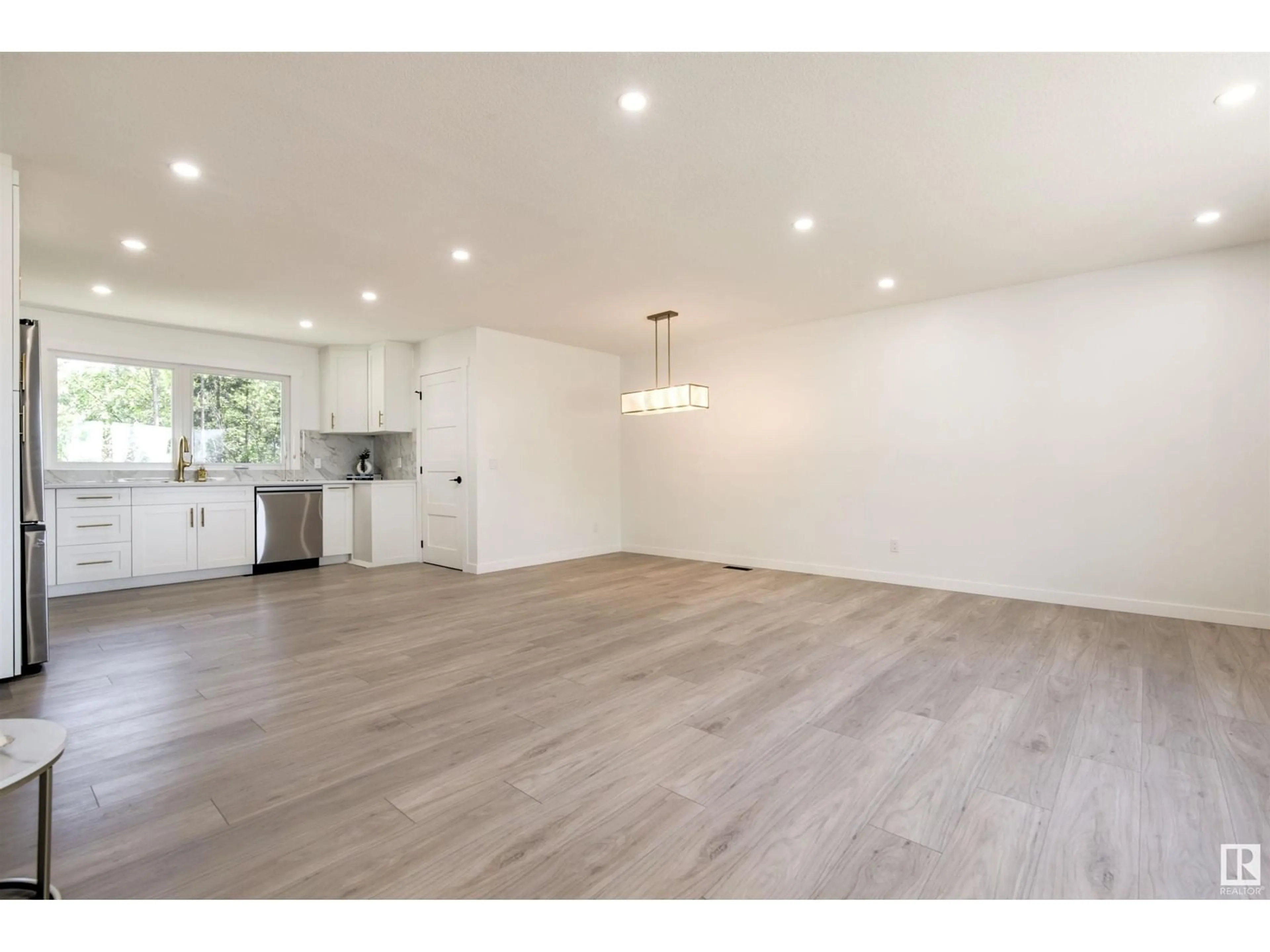 Open concept kitchen, wood/laminate floor for 19 GRENFELL AV, St. Albert Alberta T8N0Y9