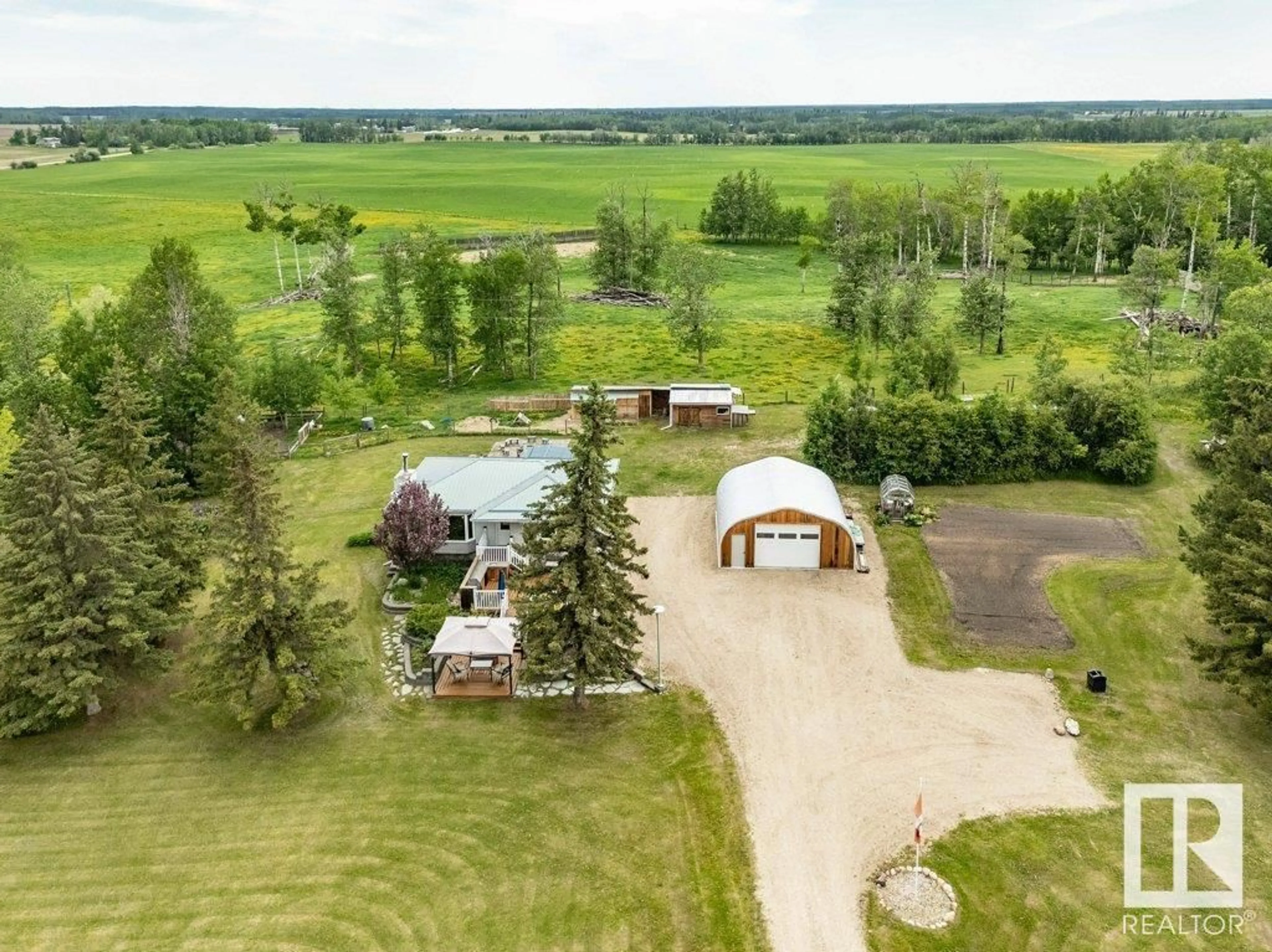 A pic from outside/outdoor area/front of a property/back of a property/a pic from drone, unknown for 104 - 2419 TWP RD 545, Rural Lac Ste. Anne County Alberta T0E1V0