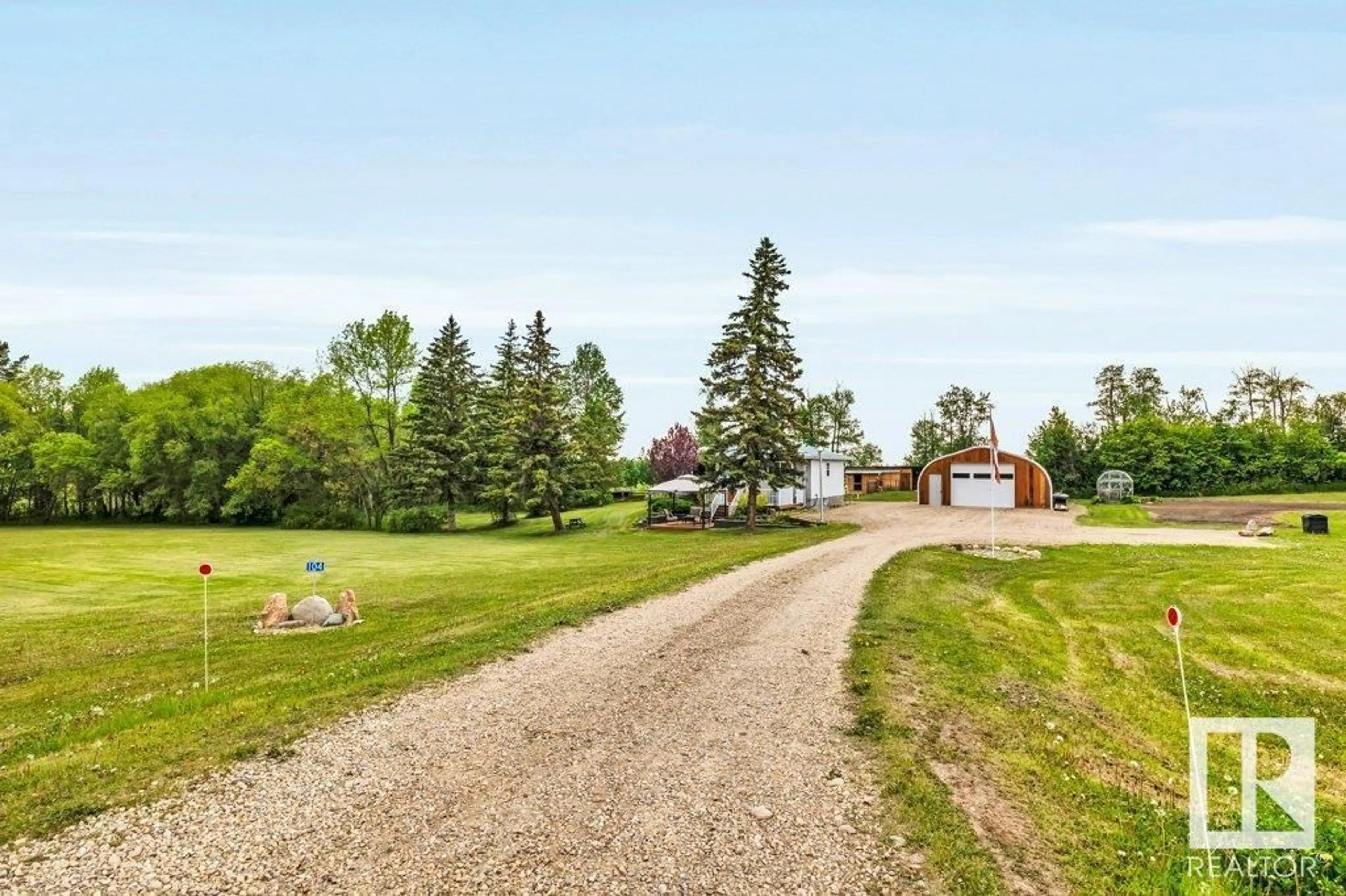 A pic from outside/outdoor area/front of a property/back of a property/a pic from drone, unknown for 104 - 2419 TWP RD 545, Rural Lac Ste. Anne County Alberta T0E1V0