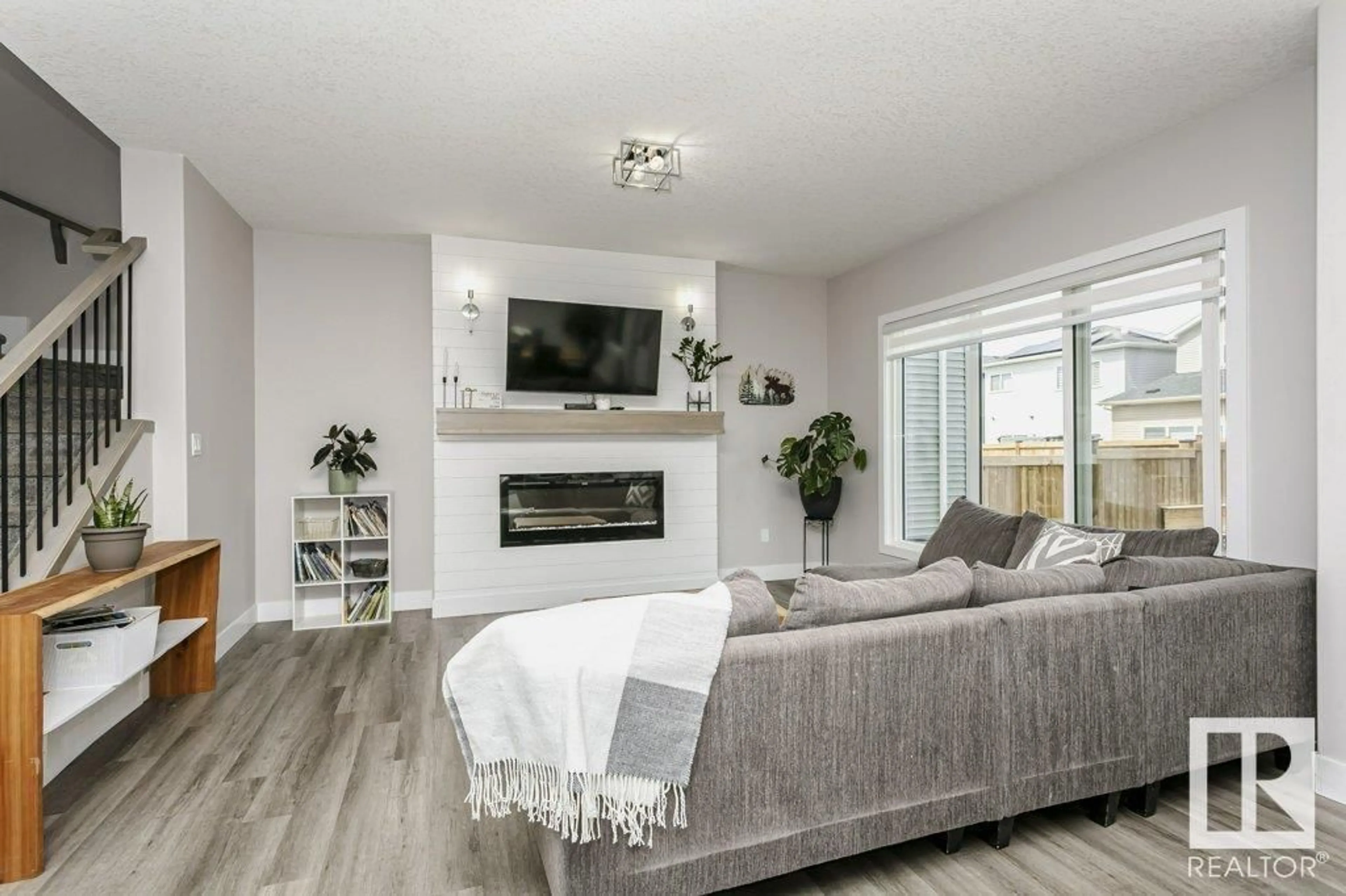 Living room with furniture, wood/laminate floor for 378 BLUFF CV, Leduc Alberta T9E1M9
