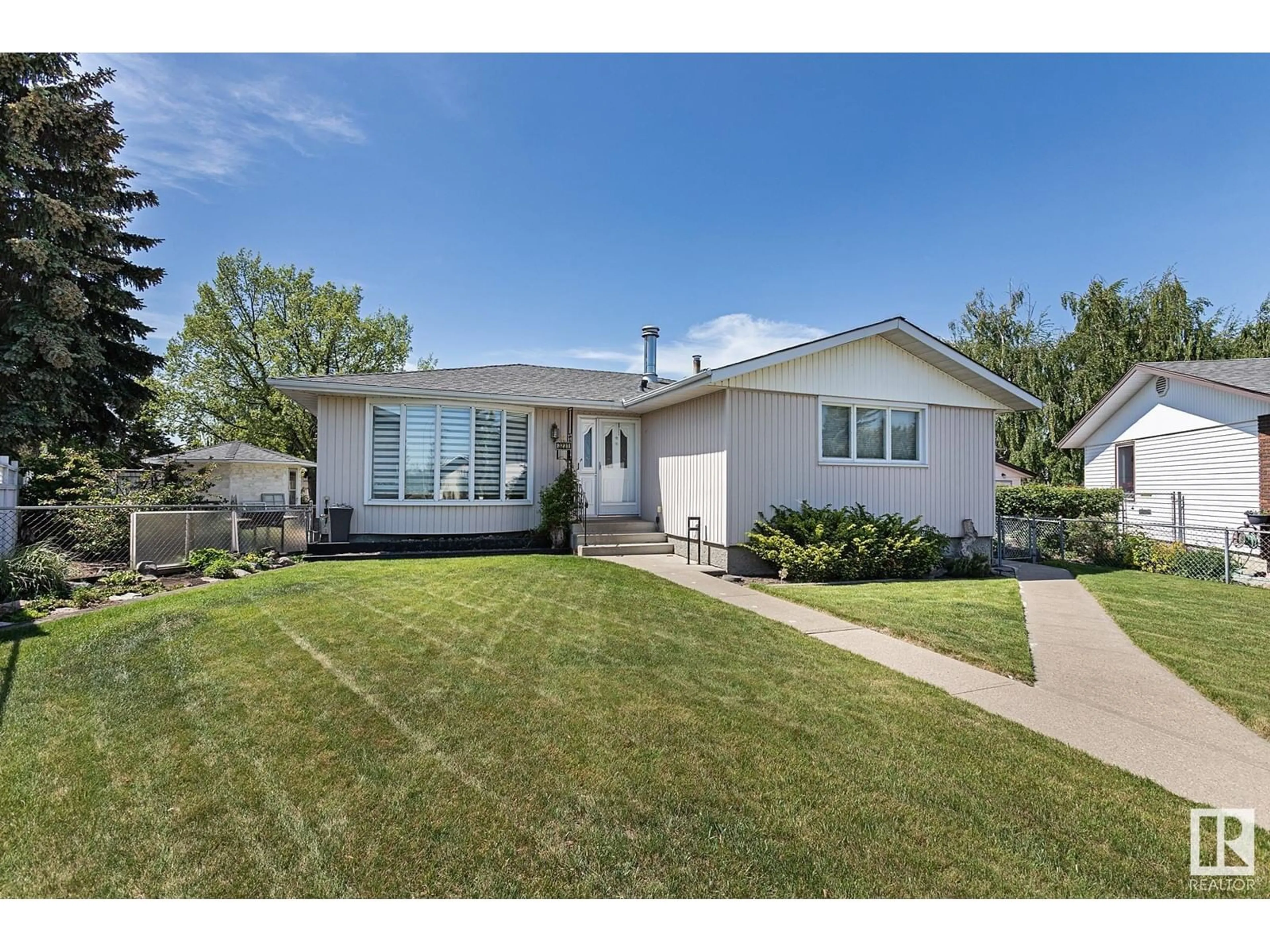 Home with vinyl exterior material, street for 3231 112 AV, Edmonton Alberta T5W0M1