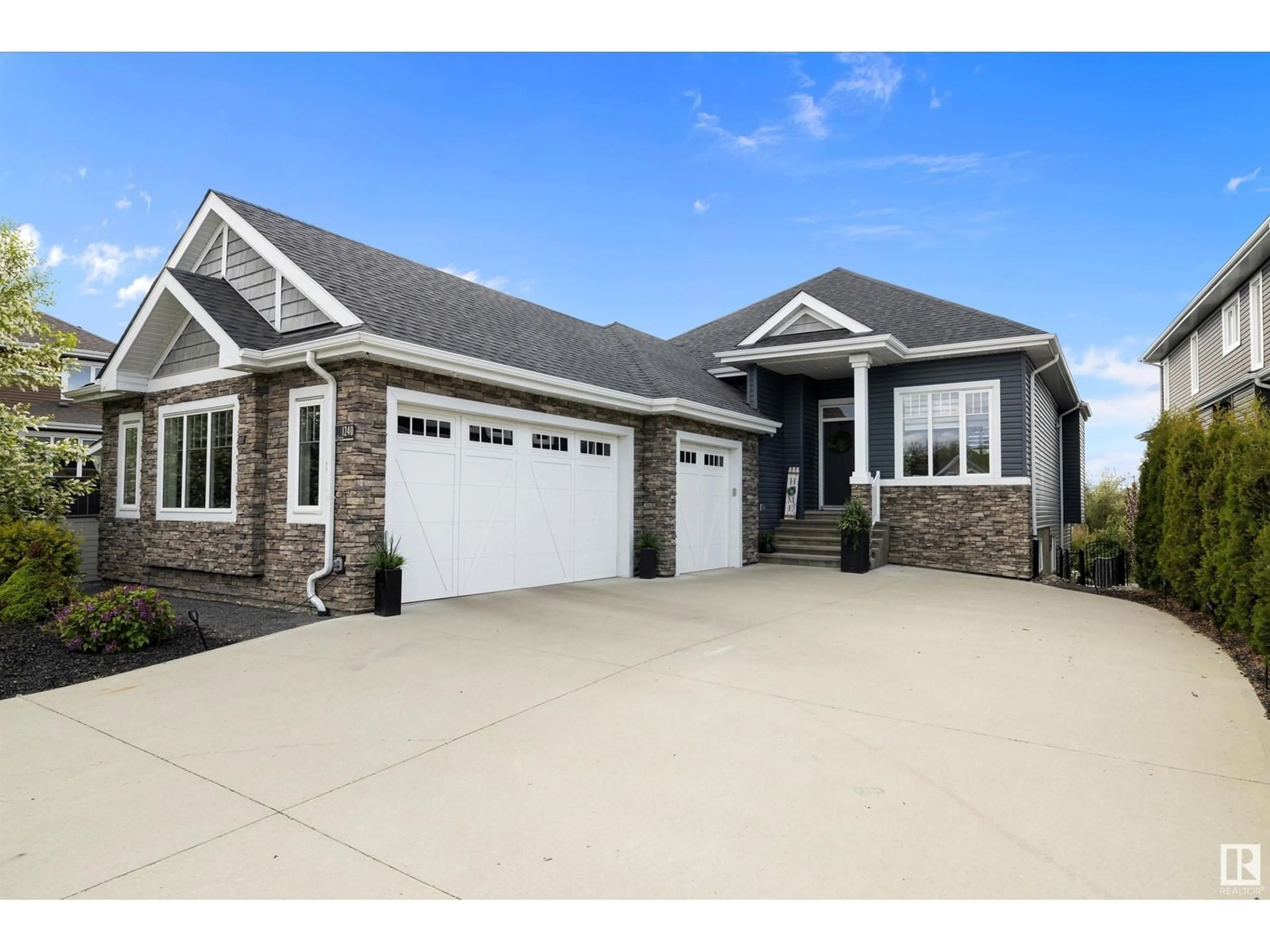 Home with vinyl exterior material, street for 1240 STARLING DR, Edmonton Alberta T5S0K4