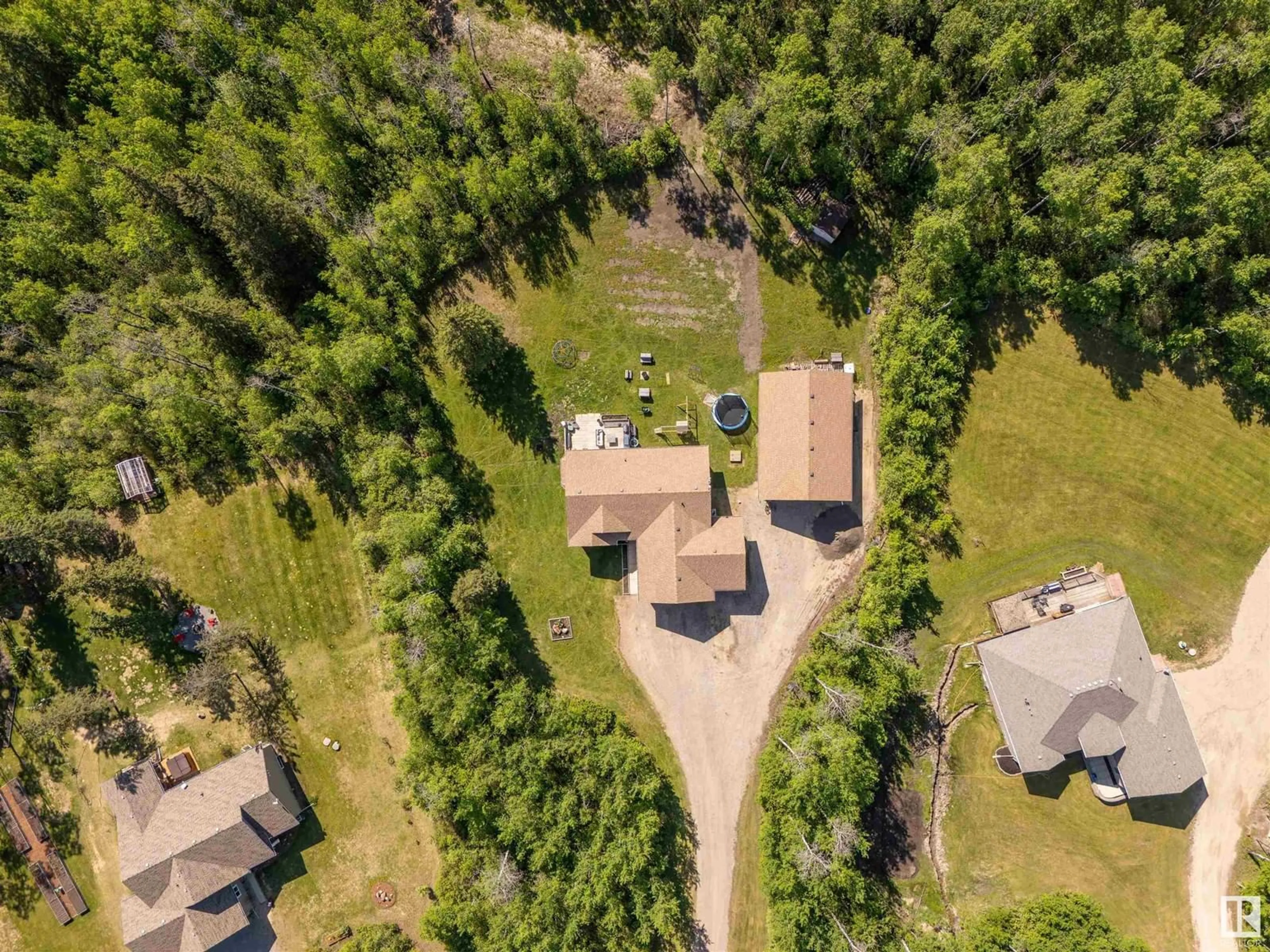 A pic from outside/outdoor area/front of a property/back of a property/a pic from drone, forest/trees view for 5 - 62101 RGE RD 421, Rural Bonnyville M.D. Alberta T9M1P2