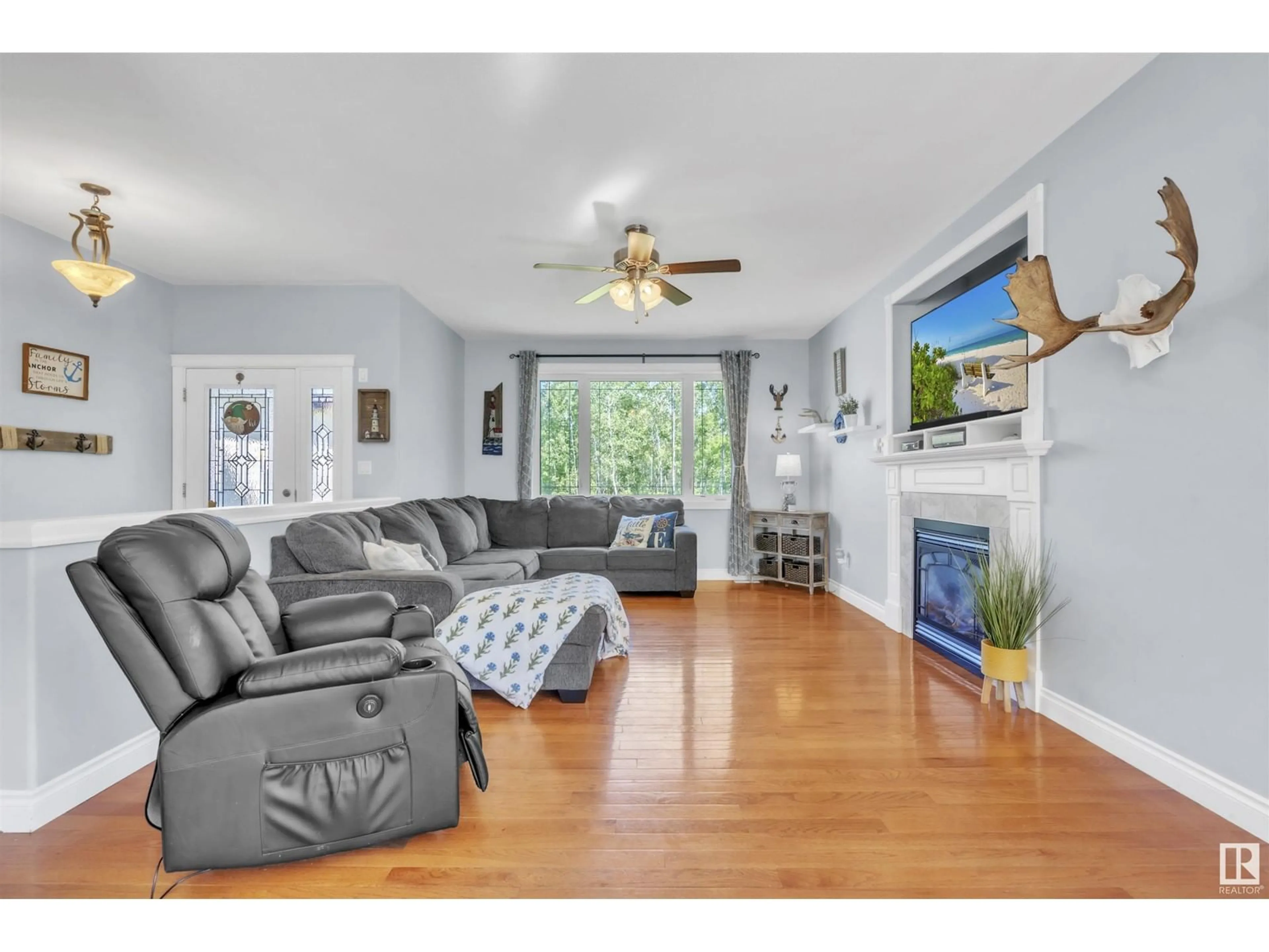 Living room with furniture, wood/laminate floor for 5 - 62101 RGE RD 421, Rural Bonnyville M.D. Alberta T9M1P2