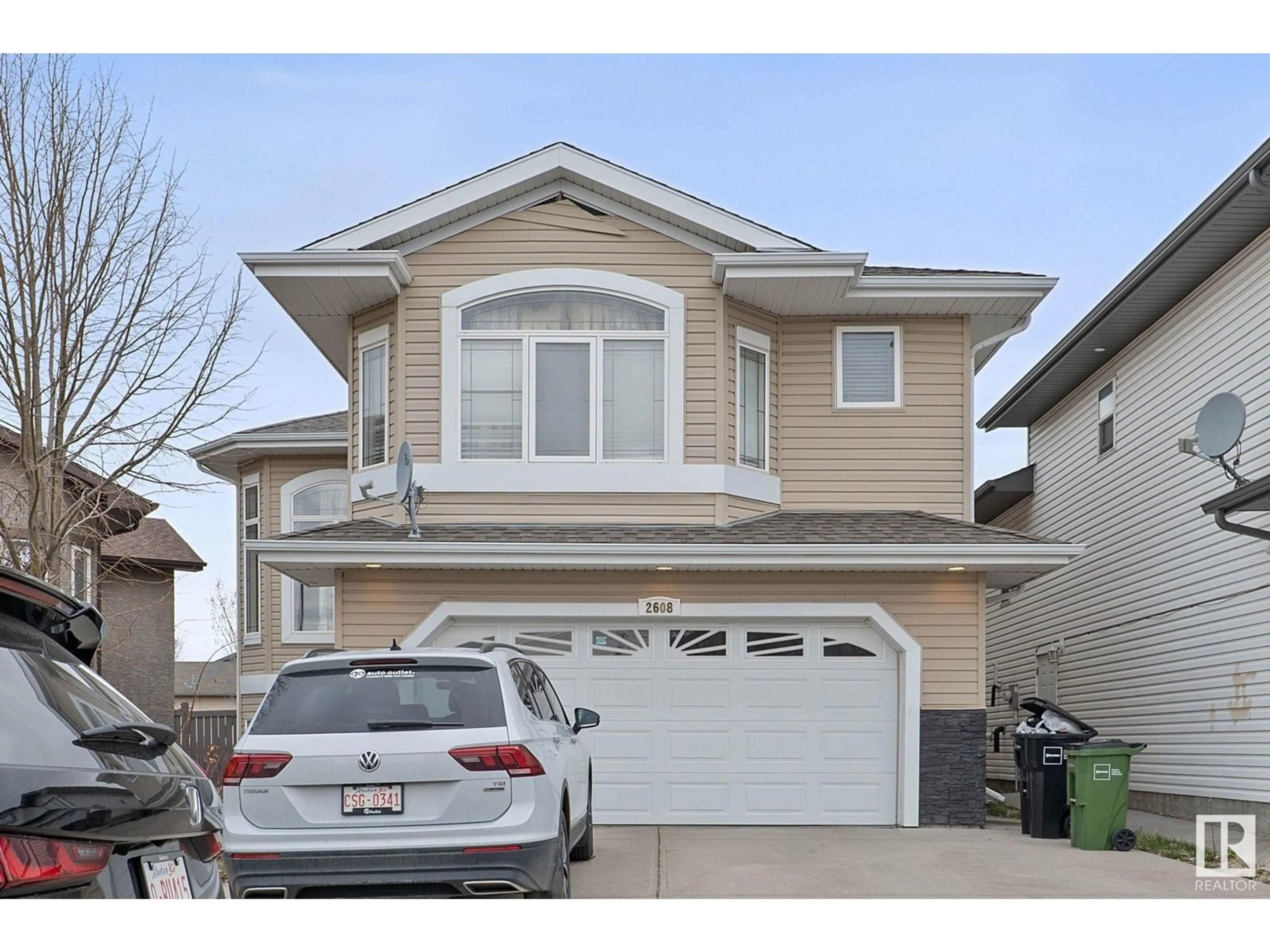 Home with vinyl exterior material, street for 2608 31 STREET, Edmonton Alberta T6T1R2