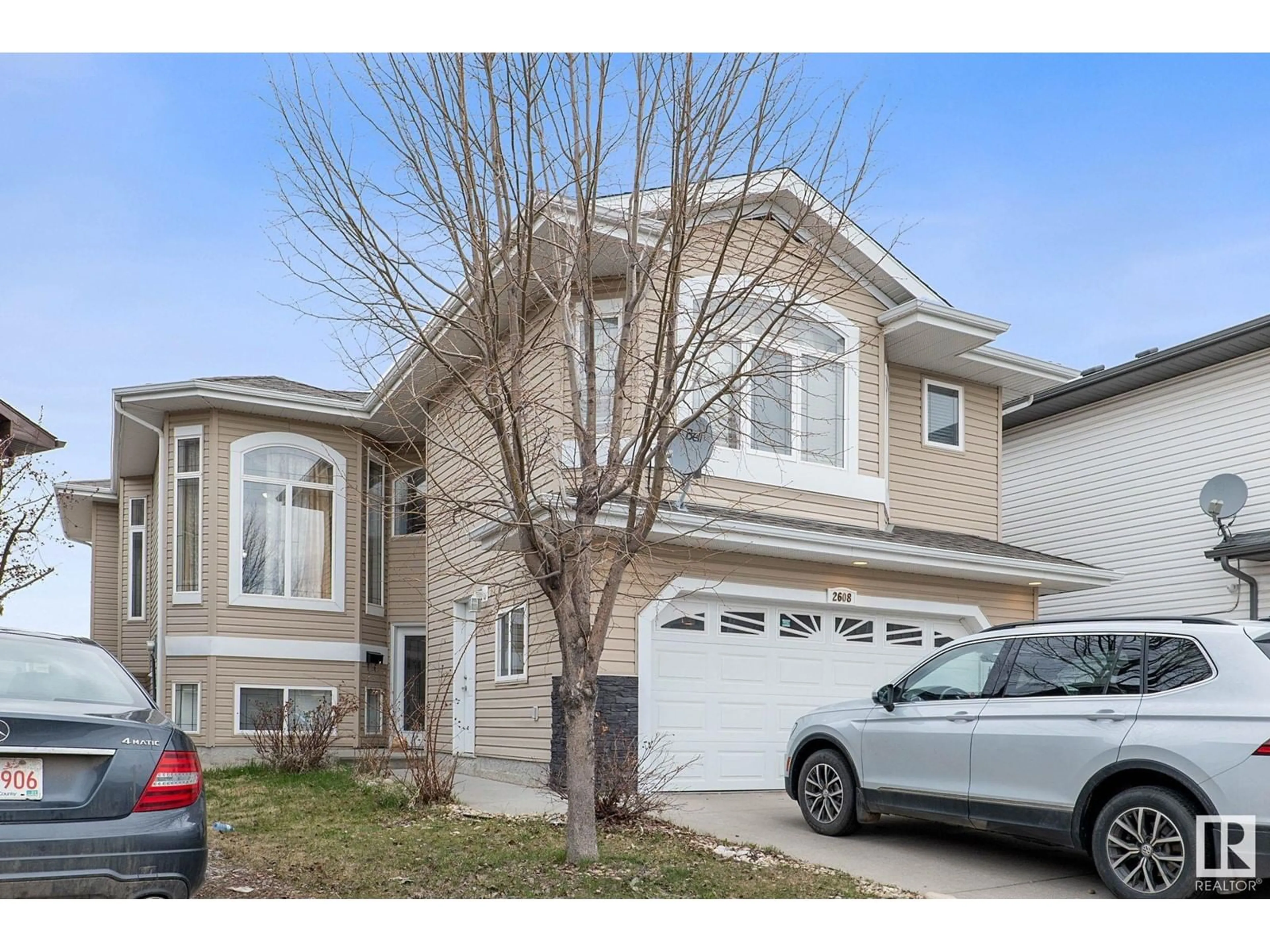Home with vinyl exterior material, street for 2608 31 STREET, Edmonton Alberta T6T1R2