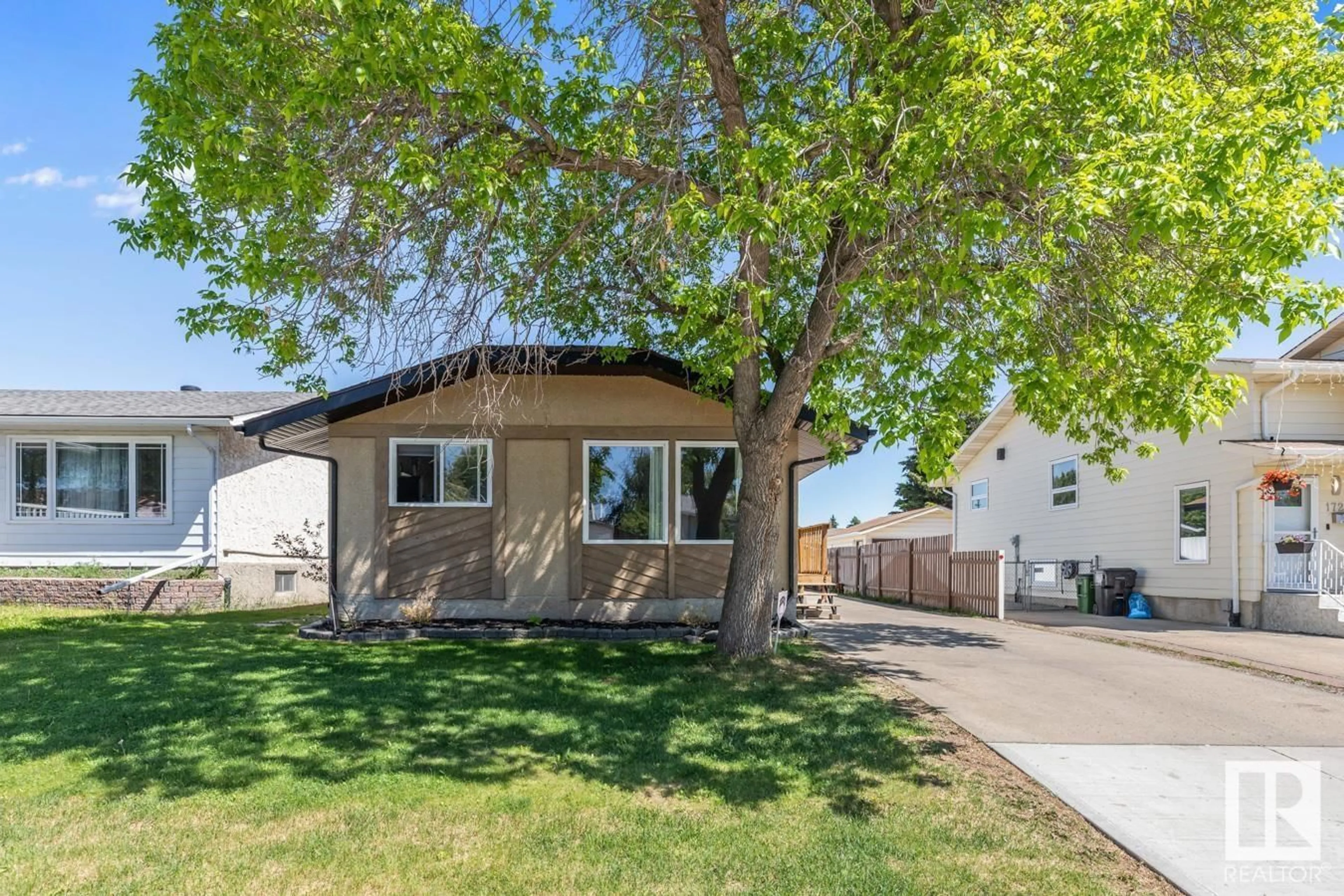Home with vinyl exterior material, street for 17211 102 ST, Edmonton Alberta T5X3X5
