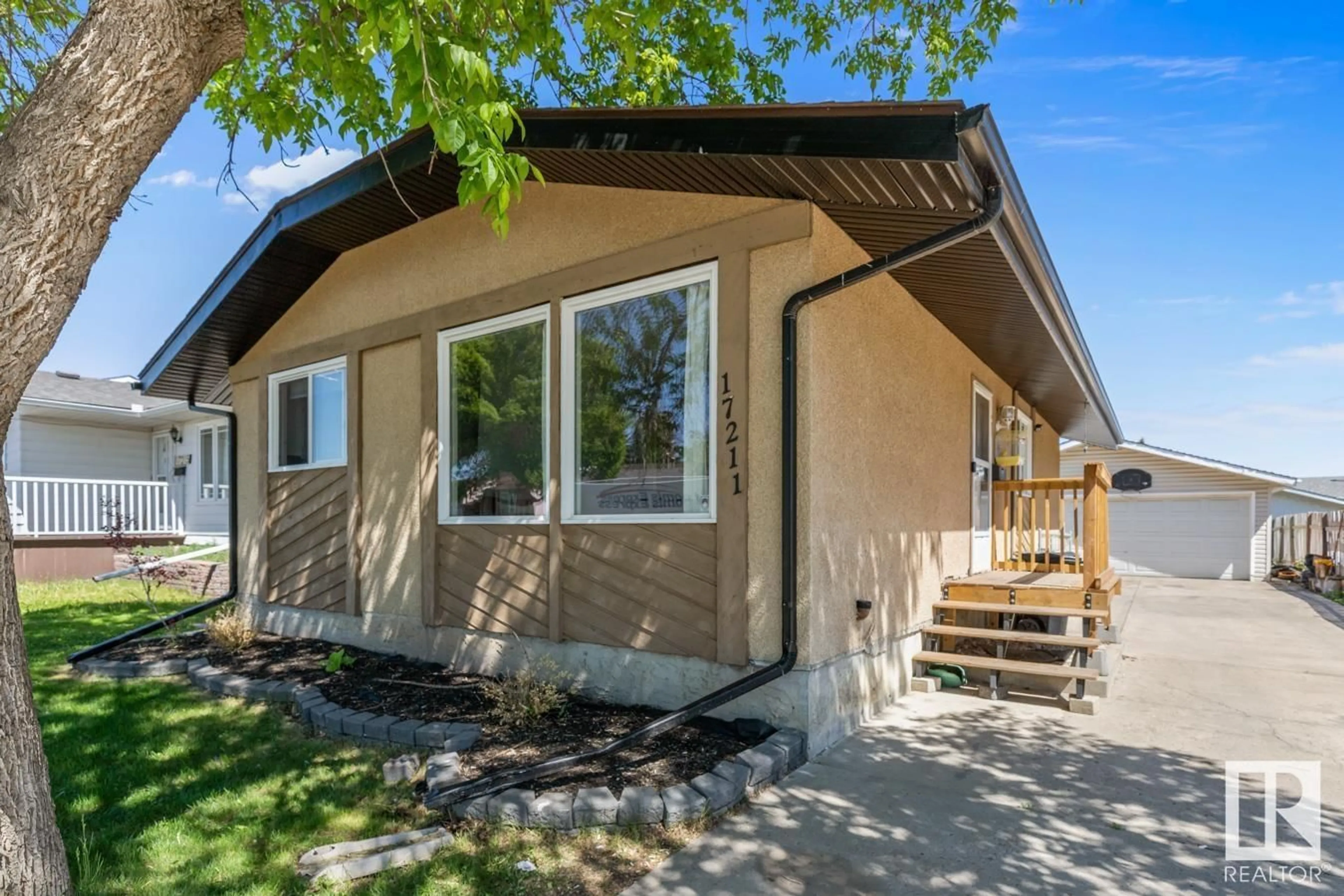 Home with vinyl exterior material, street for 17211 102 ST, Edmonton Alberta T5X3X5