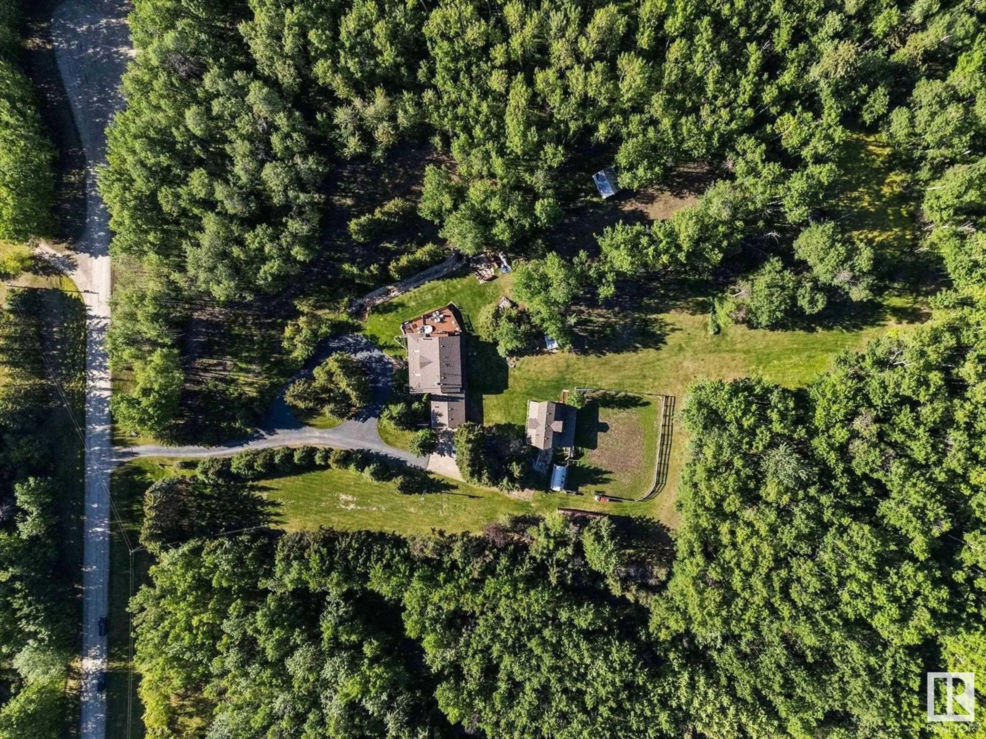 A pic from outside/outdoor area/front of a property/back of a property/a pic from drone, forest/trees view for 15 - 53223 RGE ROAD 34, Rural Parkland County Alberta T0E0N0