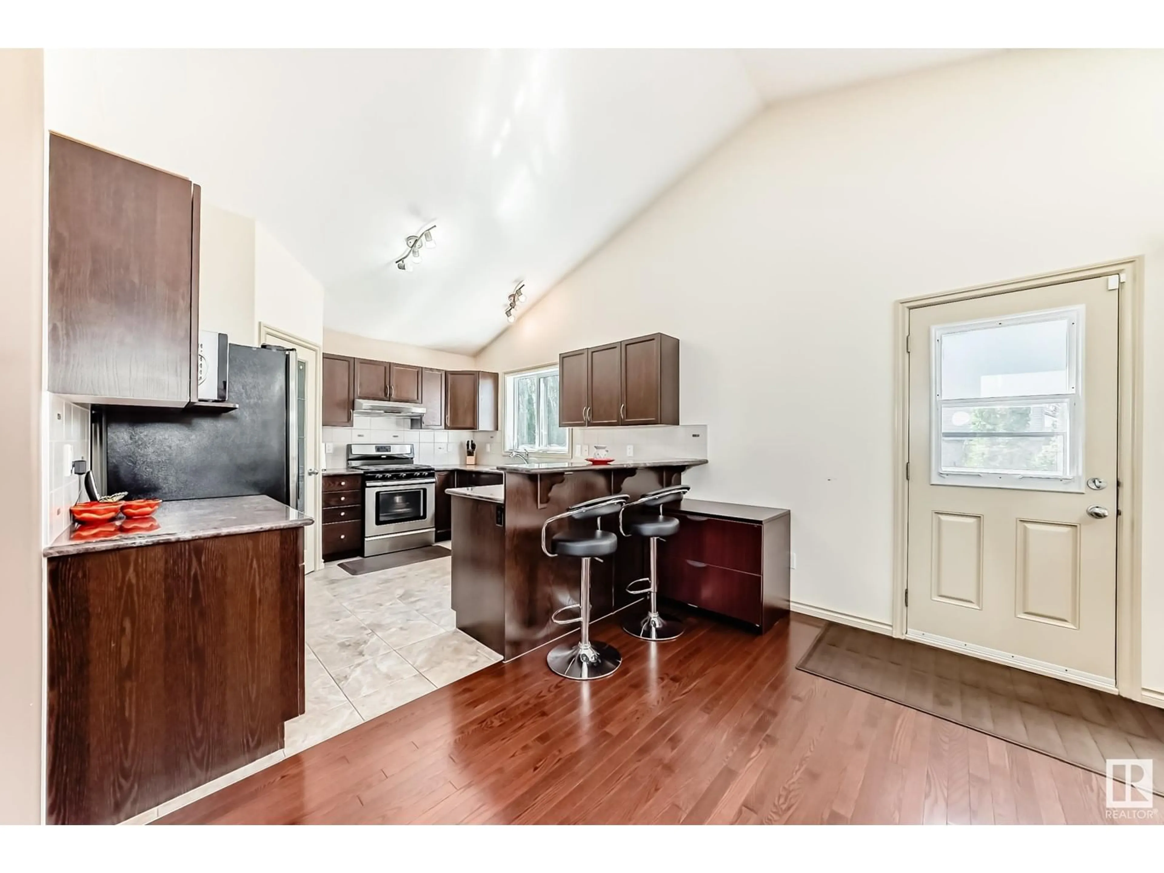 Open concept kitchen, wood/laminate floor for 1443 37C AV AV, Edmonton Alberta T6T0H8