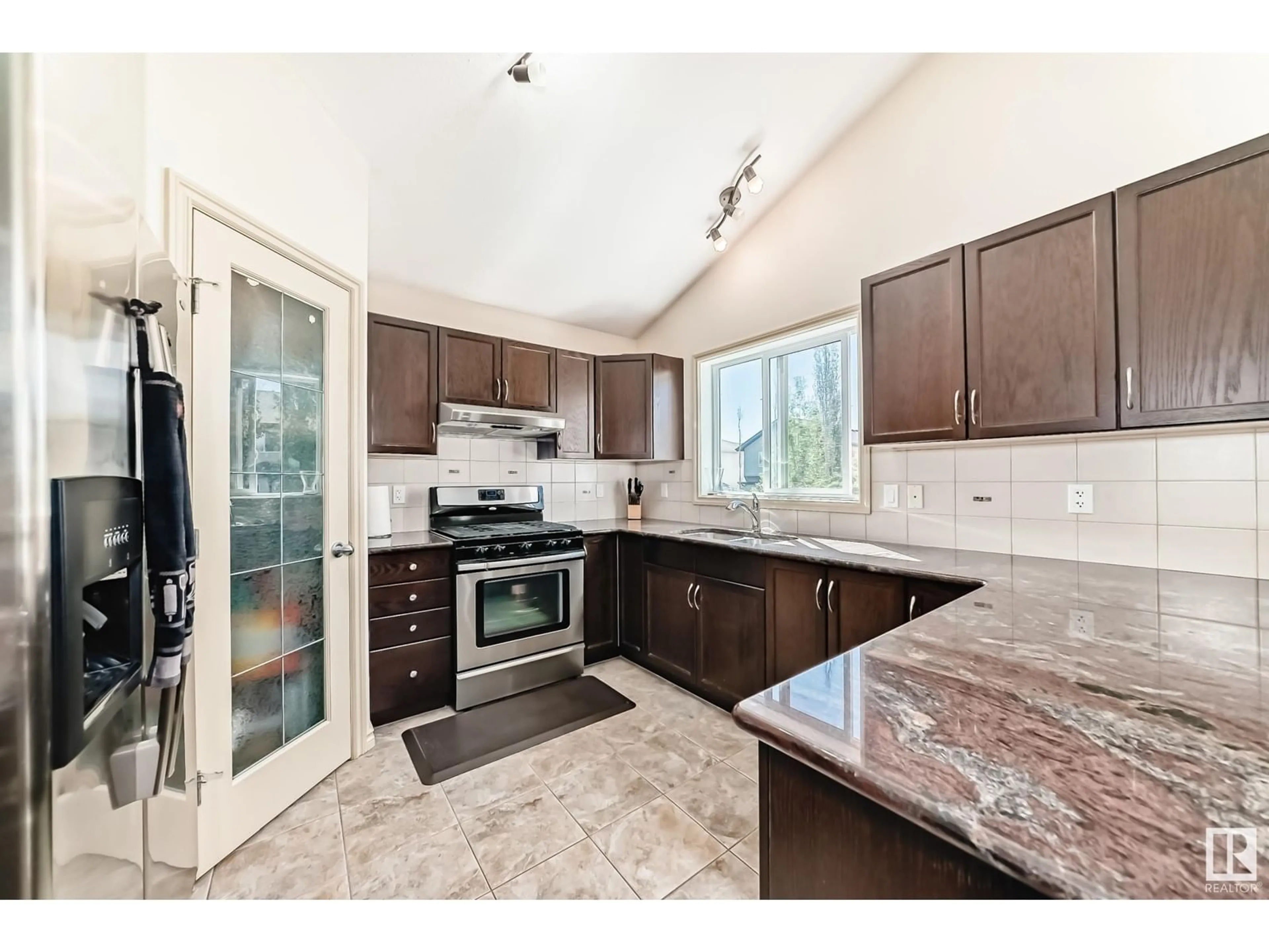 Open concept kitchen, ceramic/tile floor for 1443 37C AV AV, Edmonton Alberta T6T0H8