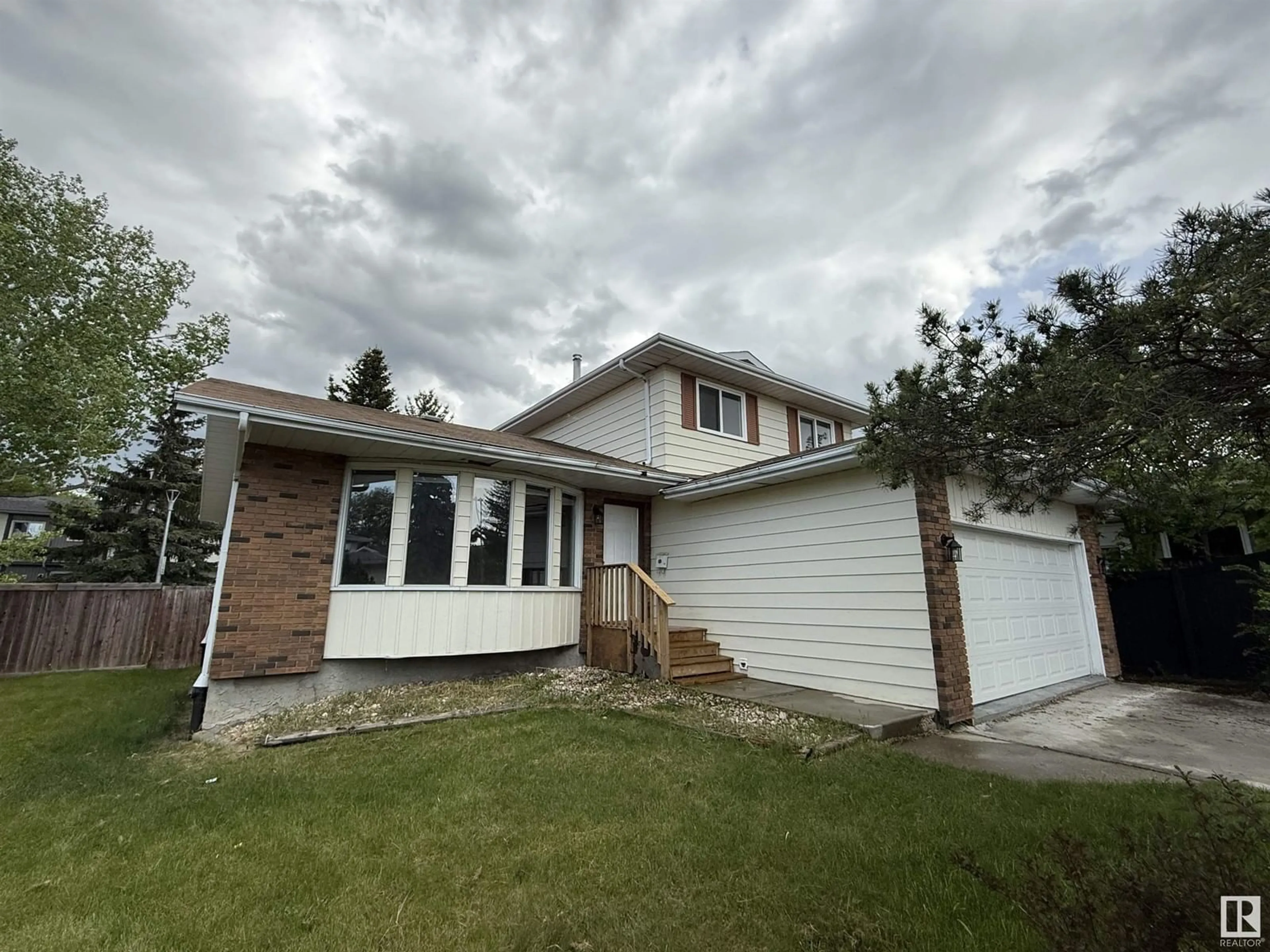 Home with vinyl exterior material, street for NW - 18524 62B AV, Edmonton Alberta T5T2N7