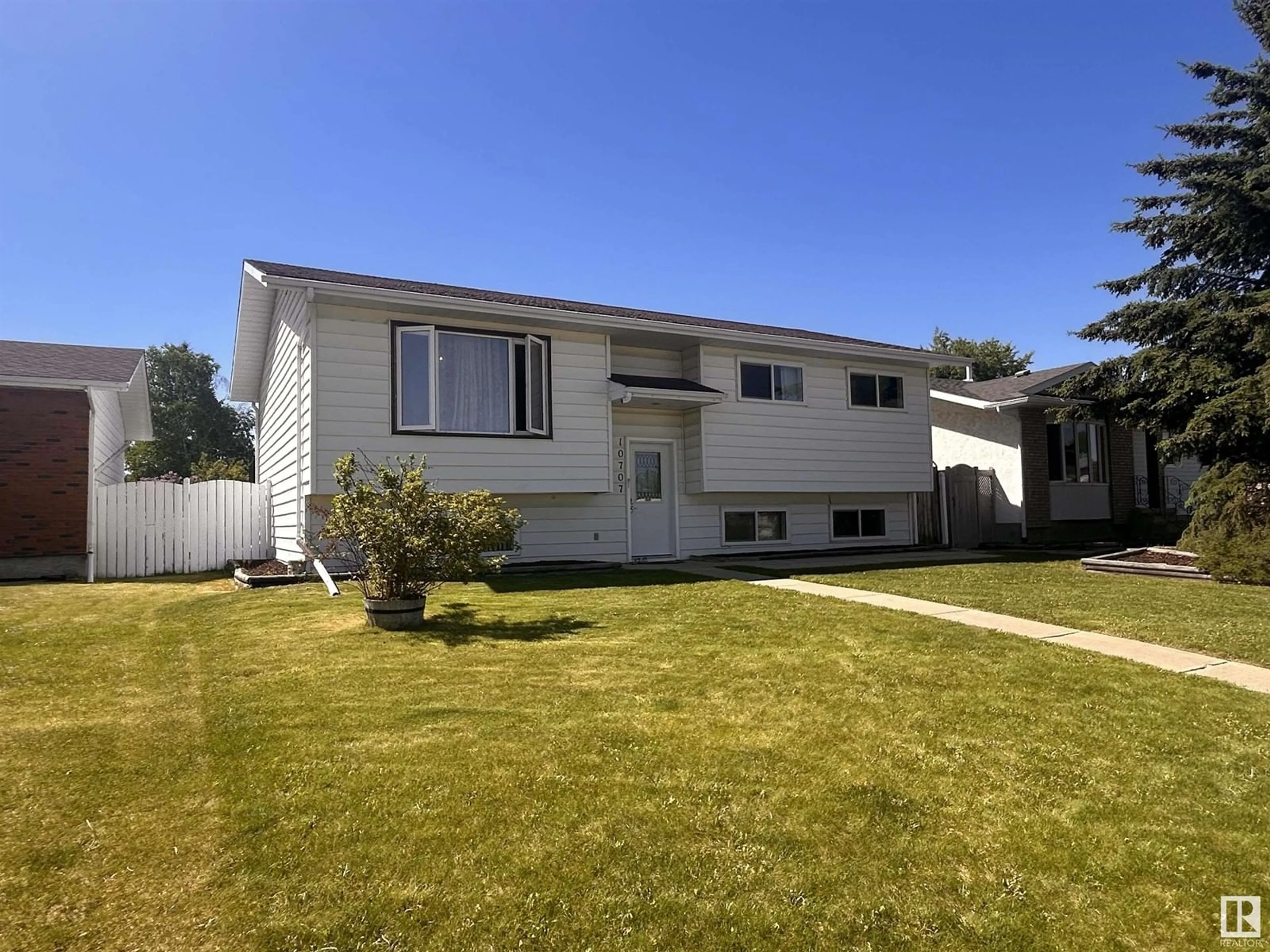 Home with vinyl exterior material, street for 10707 108 A AV, Westlock Alberta T7P1C5