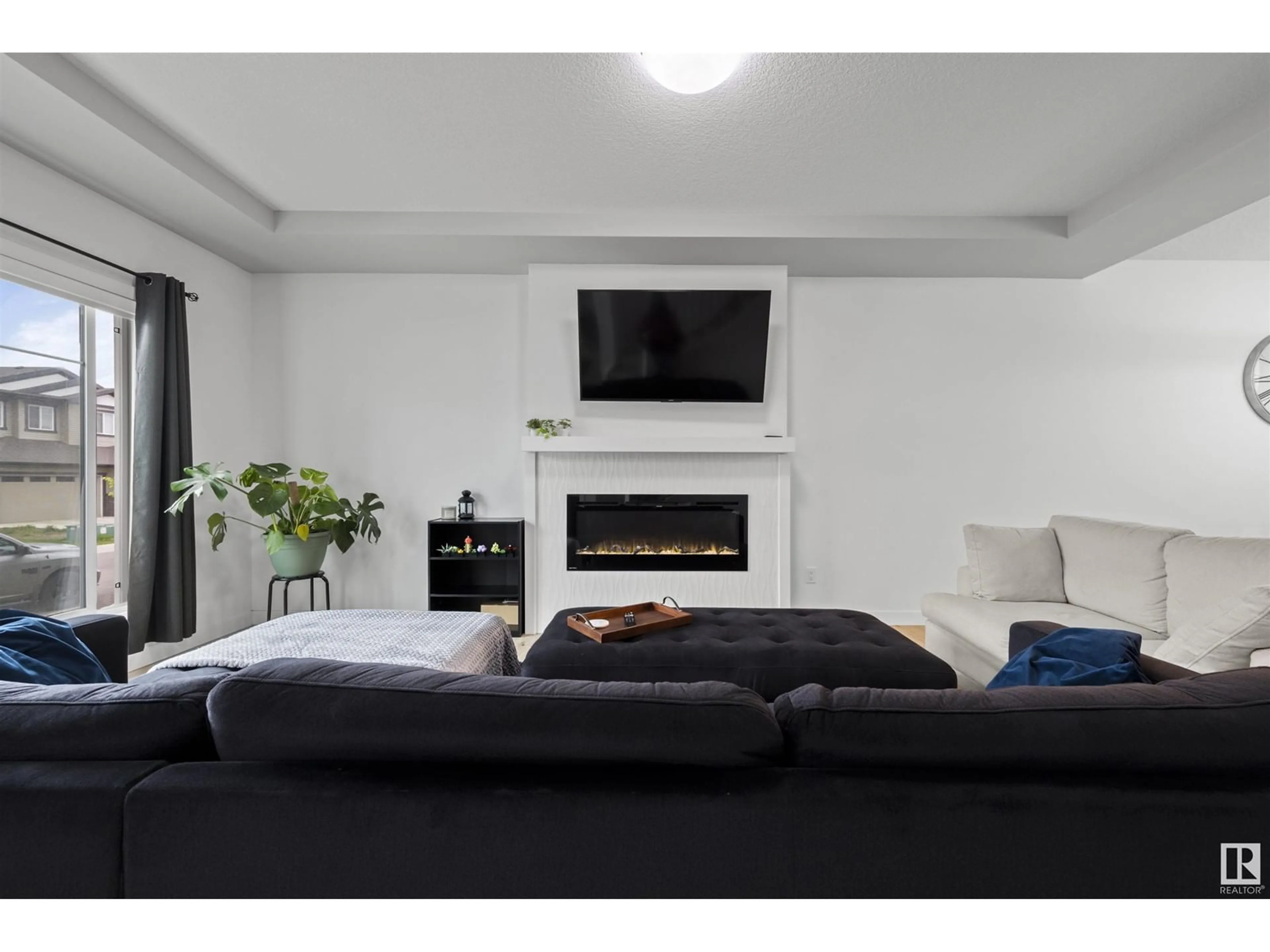 Living room with furniture, unknown for 6539 176 AV, Edmonton Alberta T5Y4B2