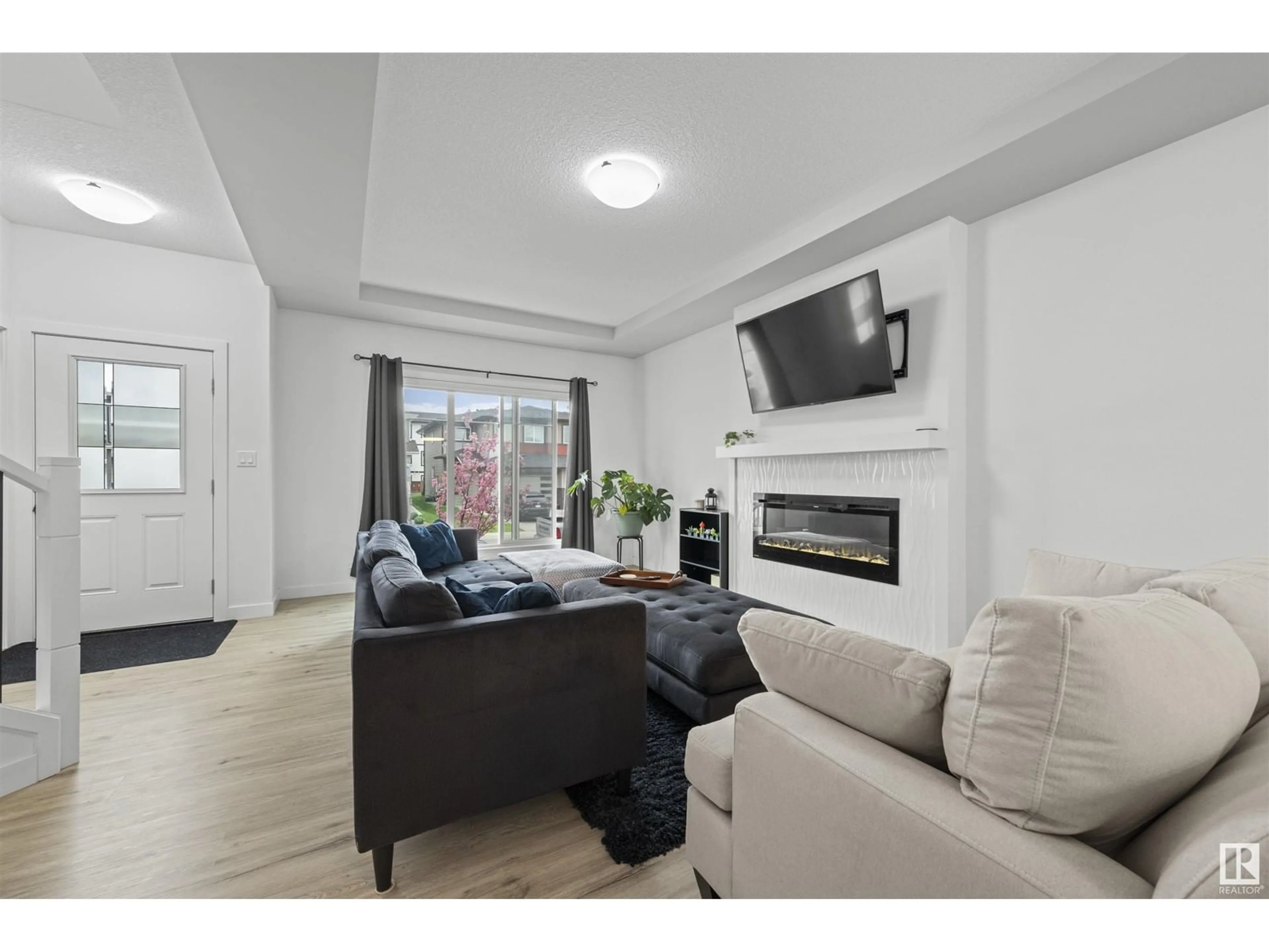 Living room with furniture, unknown for 6539 176 AV, Edmonton Alberta T5Y4B2