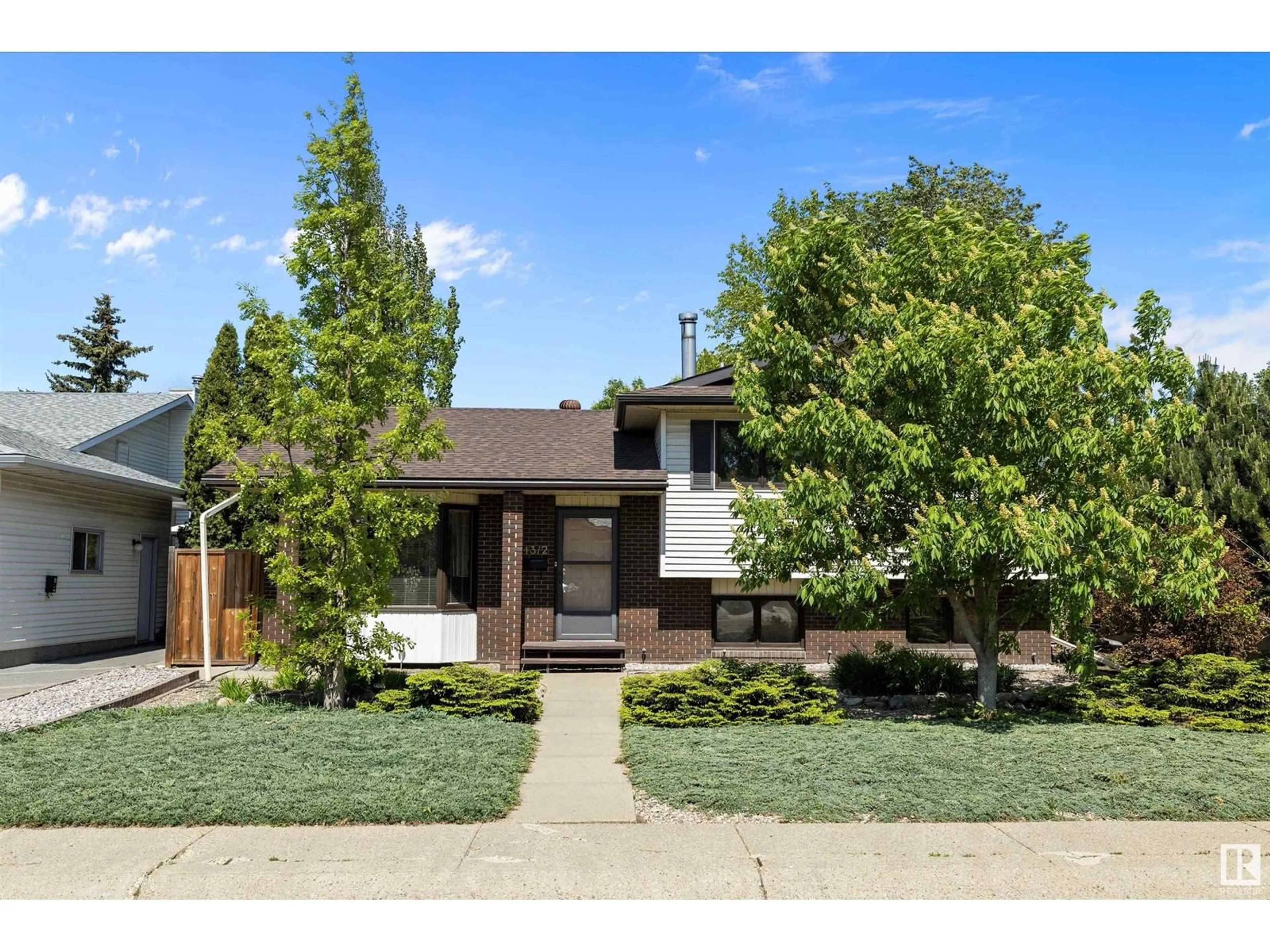 Home with brick exterior material, street for 4312 124 AV, Edmonton Alberta T5W5B9