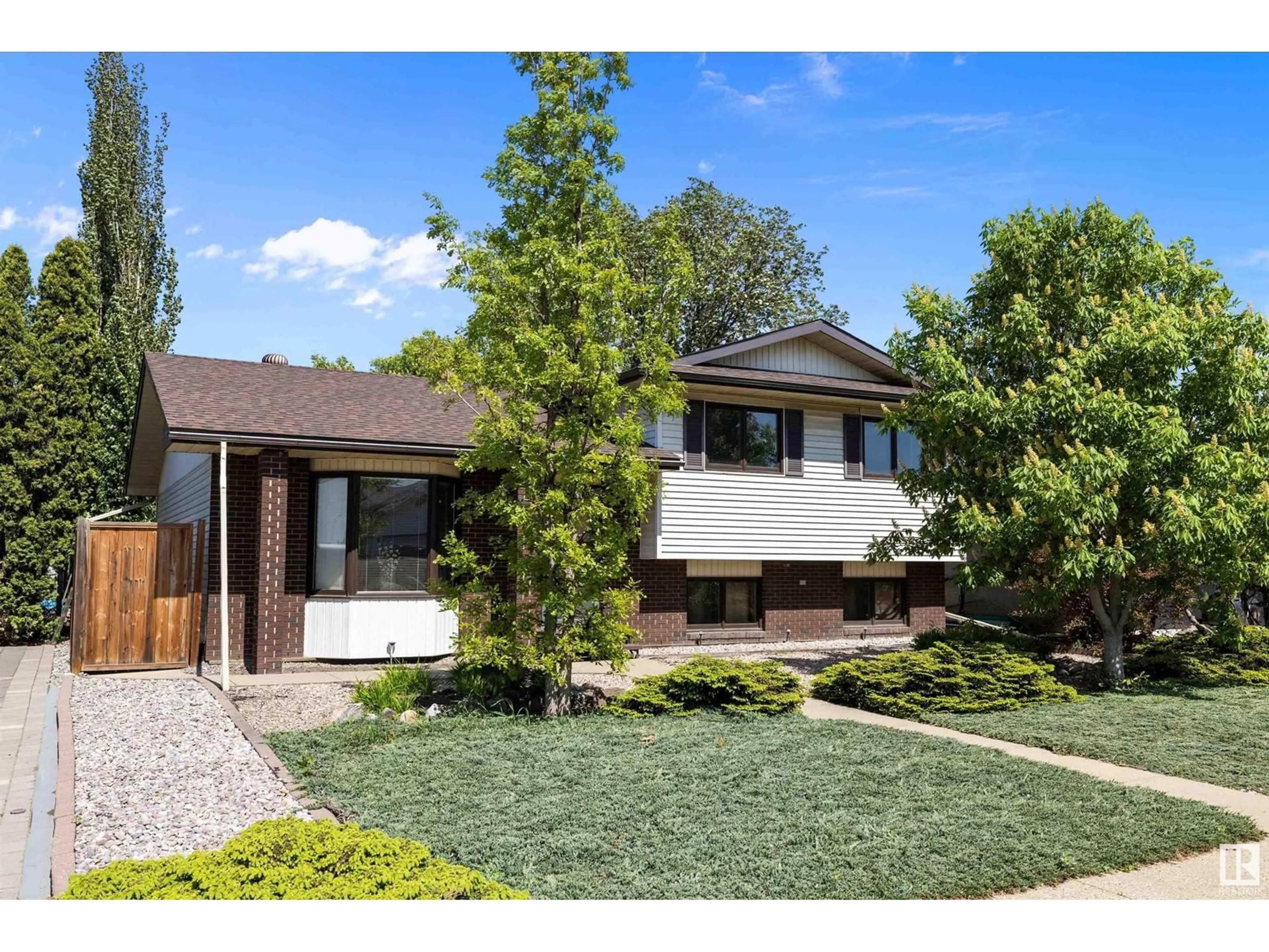 Home with brick exterior material, street for 4312 124 AV, Edmonton Alberta T5W5B9
