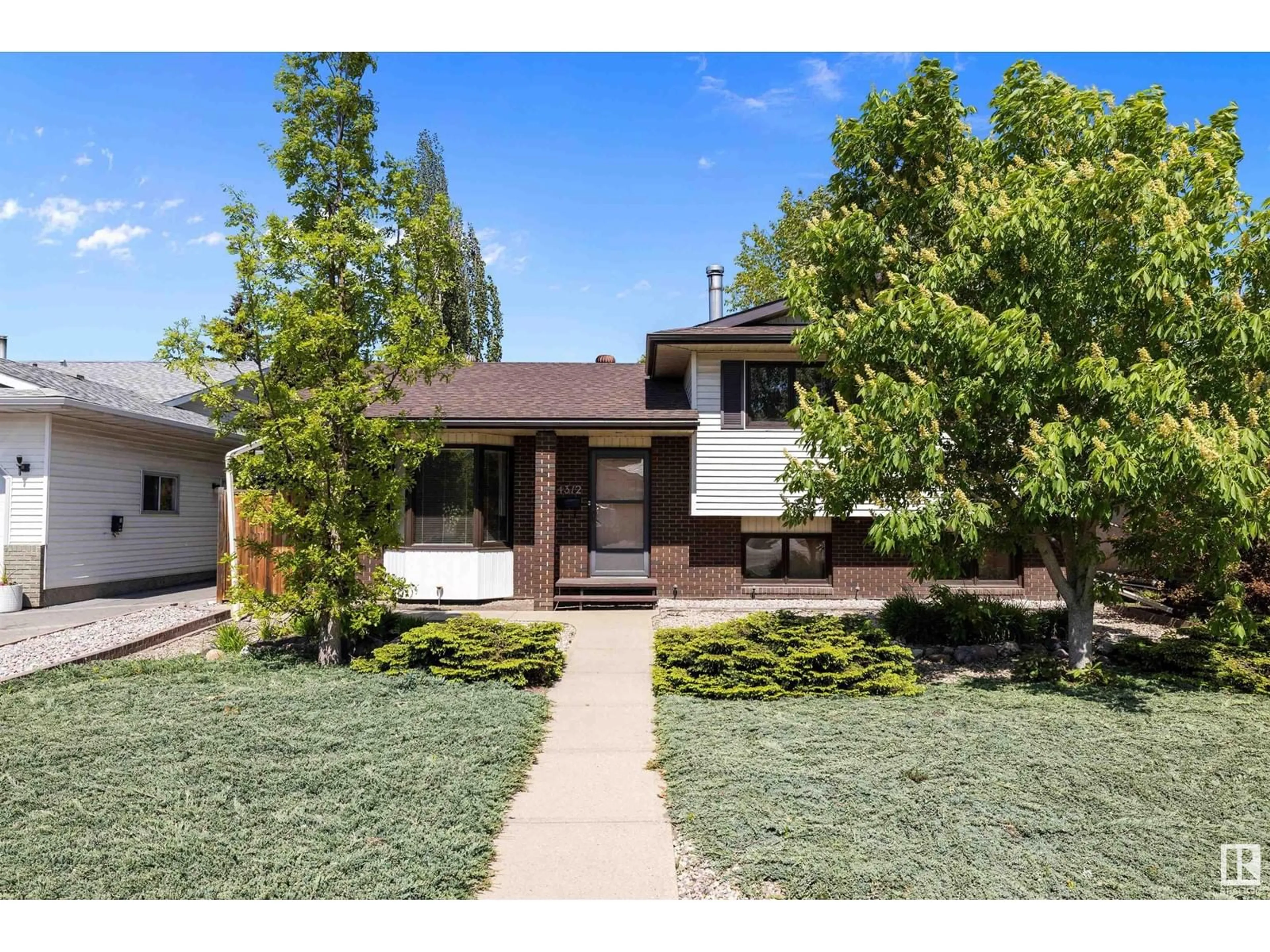Home with brick exterior material, street for 4312 124 AV, Edmonton Alberta T5W5B9