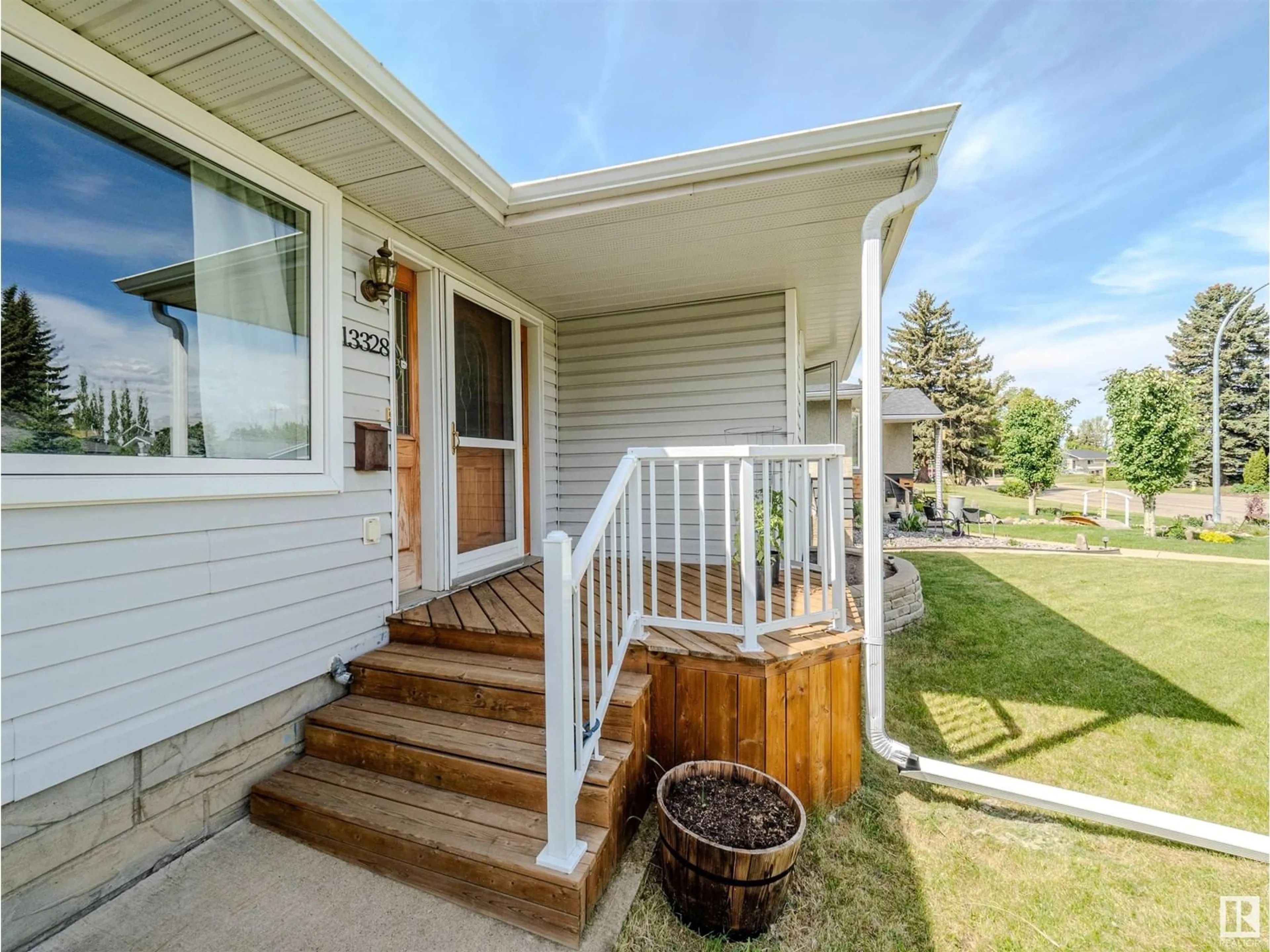 Home with vinyl exterior material, street for NW - 13328 123 ST, Edmonton Alberta T5L0J9