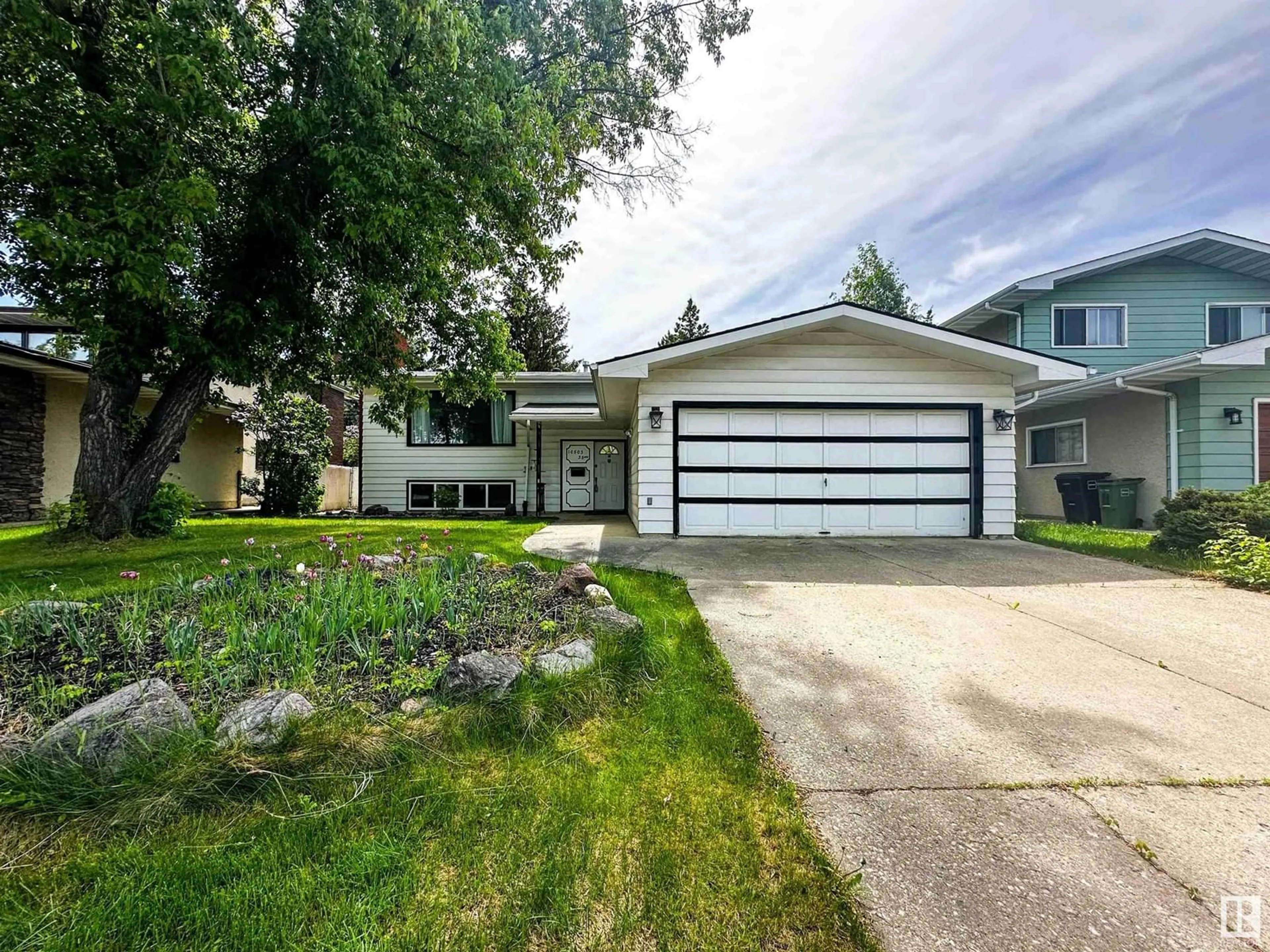 Home with vinyl exterior material, street for 10503 35 AV, Edmonton Alberta T6J2M1