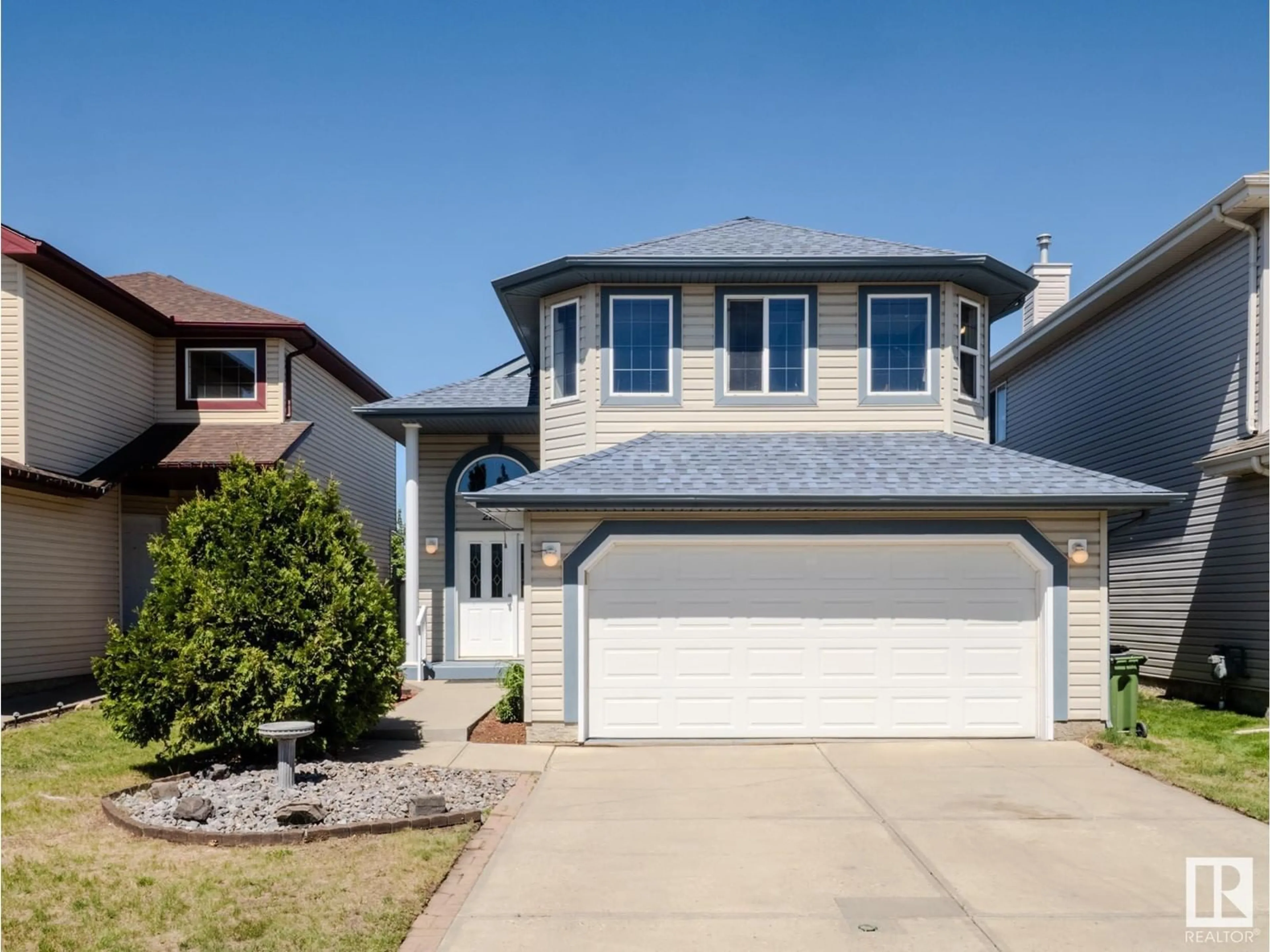 Home with vinyl exterior material, street for NW - 21234 88A AV, Edmonton Alberta T5T6V2