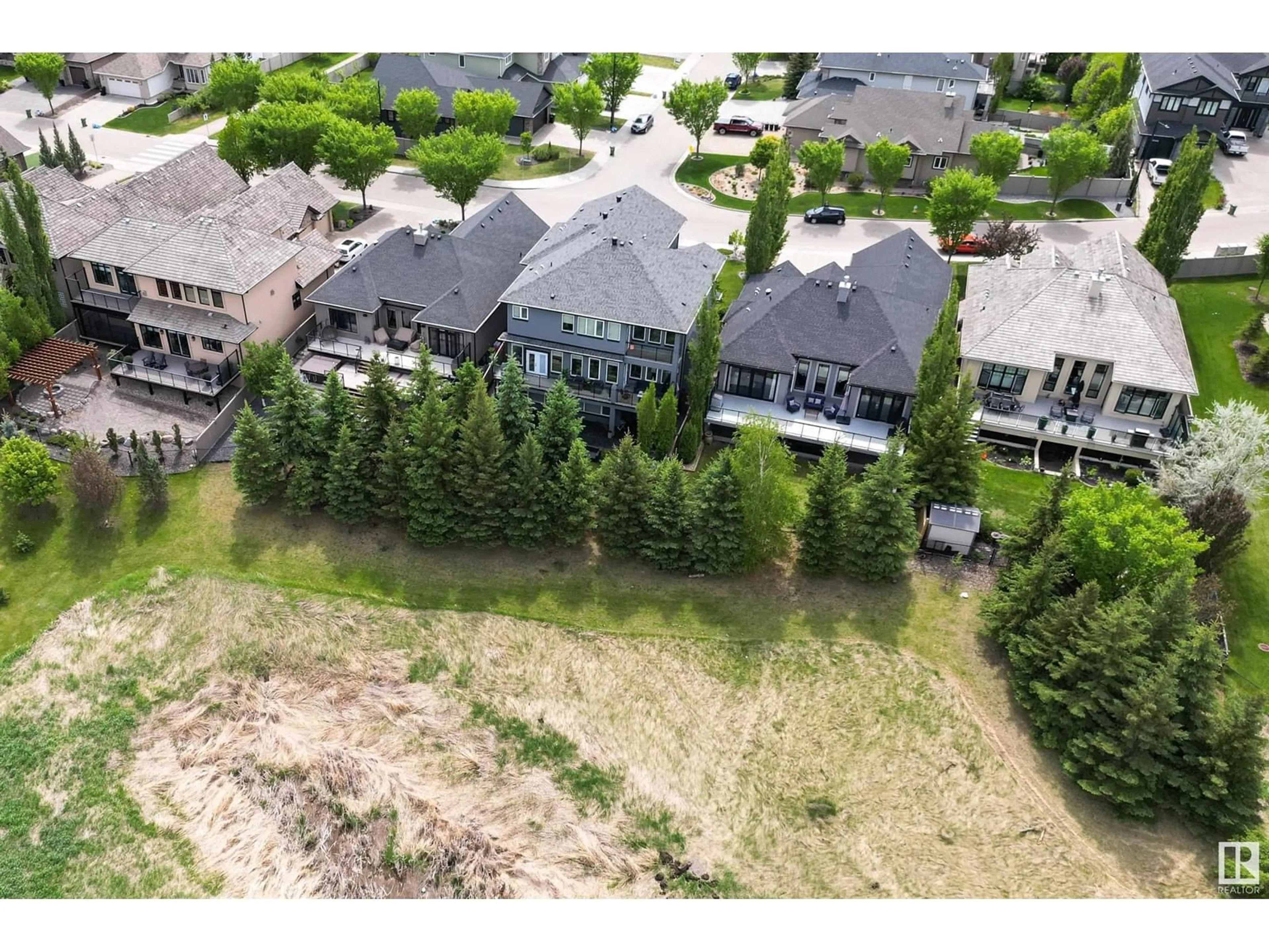 A pic from outside/outdoor area/front of a property/back of a property/a pic from drone, street for 1190 ADAMSON DR, Edmonton Alberta T6W0V4