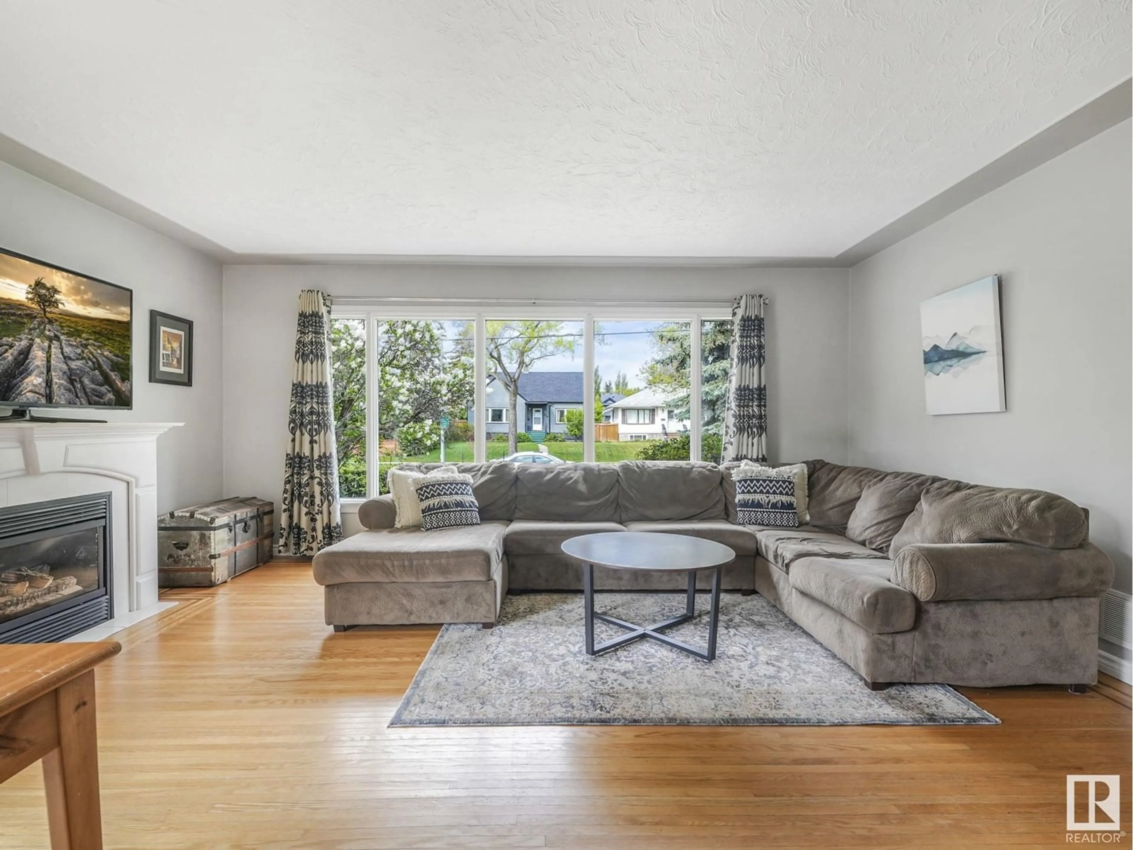 Living room with furniture, unknown for 10907 116 ST NW, Edmonton Alberta T5H3M7