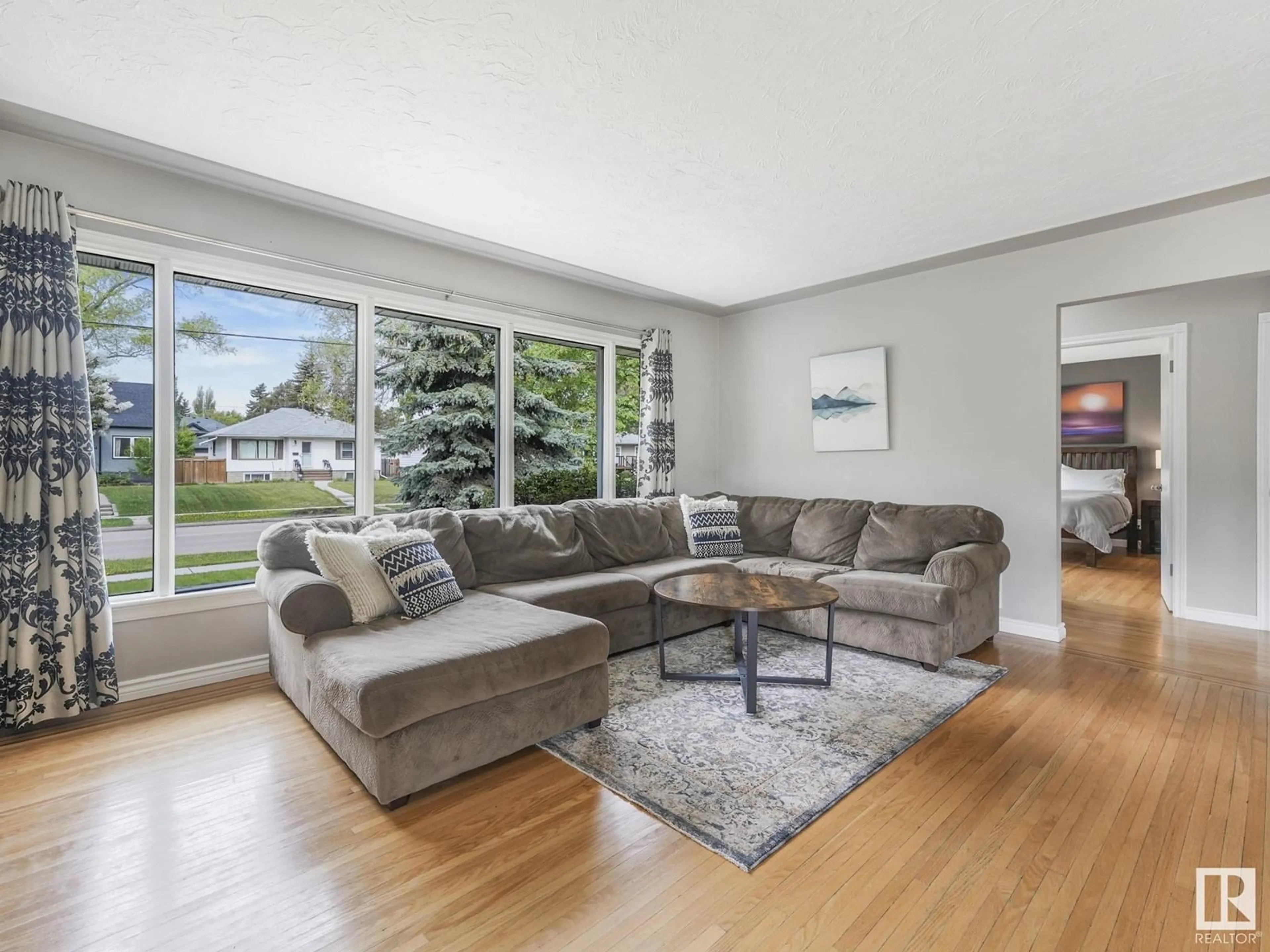 Living room with furniture, unknown for 10907 116 ST NW, Edmonton Alberta T5H3M7