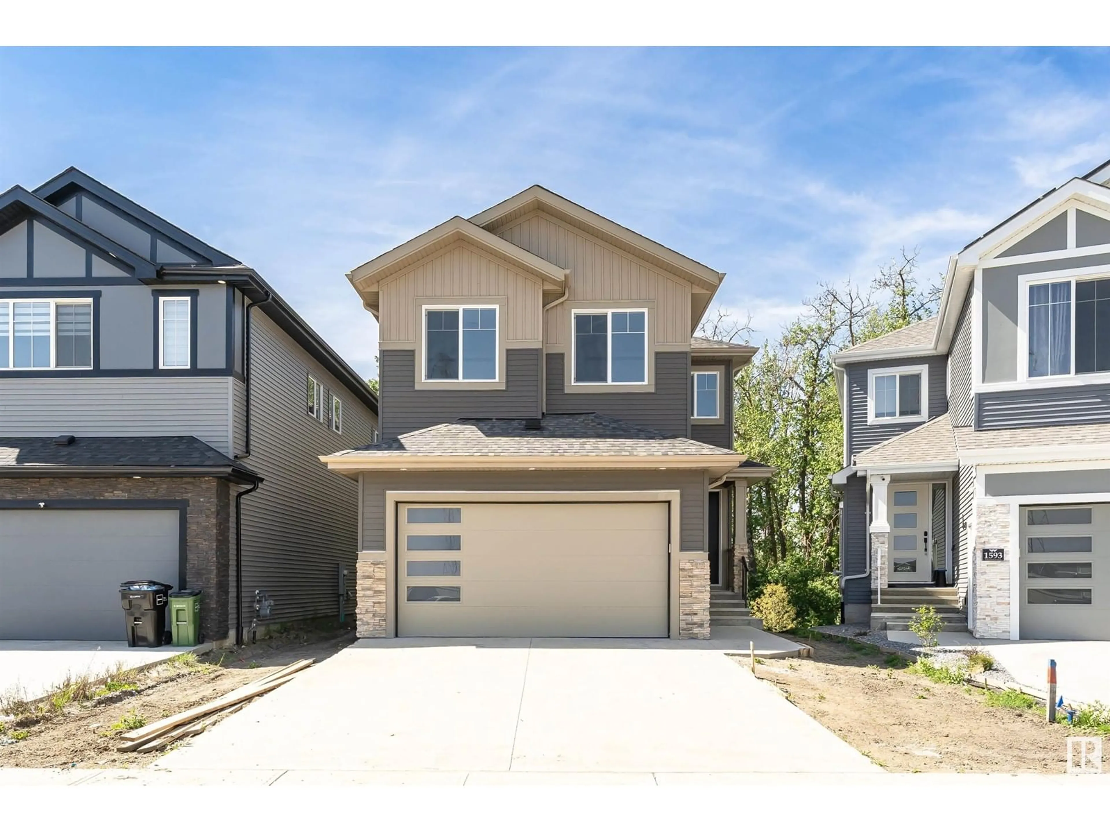 Home with vinyl exterior material, street for 1591 ESAIW PLACE, Edmonton Alberta T6M0E5