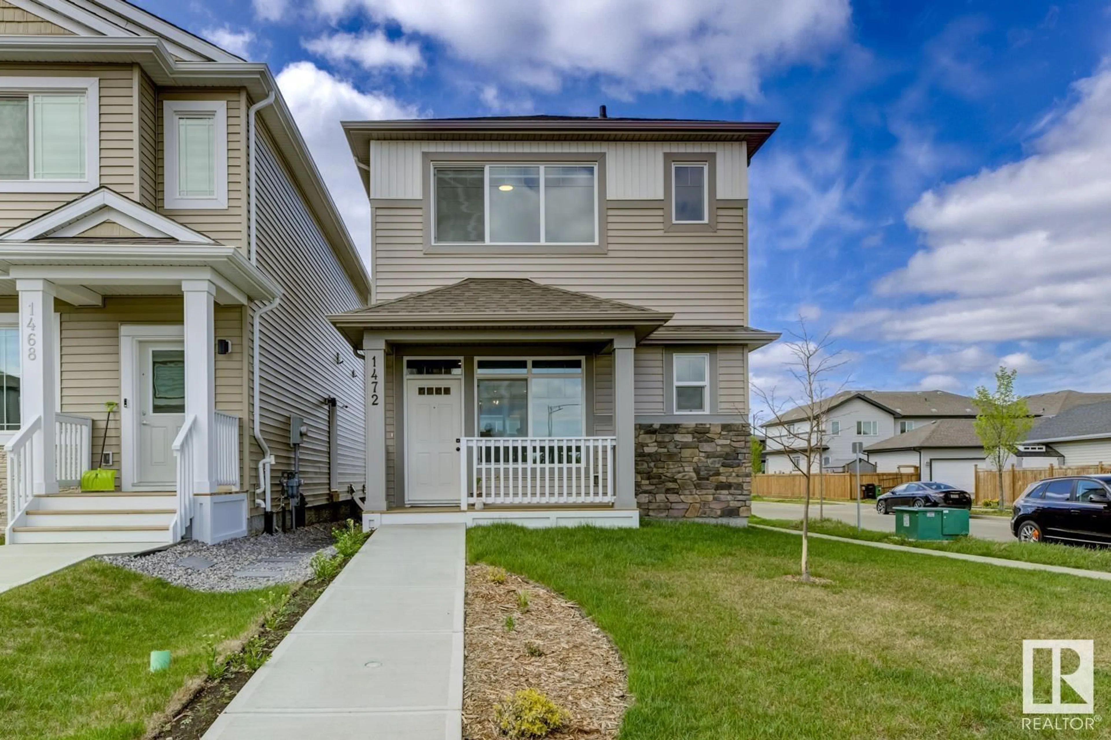 Home with vinyl exterior material, street for NW - 1472 22 ST, Edmonton Alberta T6T2R4