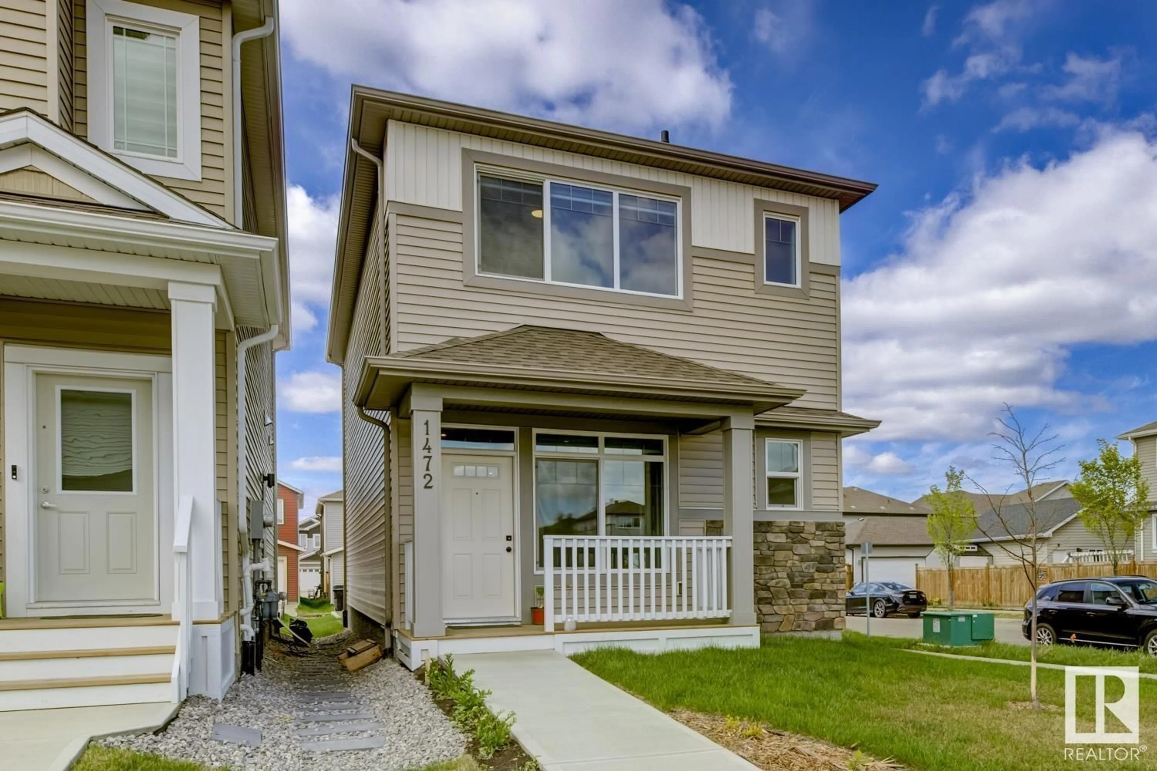 Home with vinyl exterior material, street for NW - 1472 22 ST, Edmonton Alberta T6T2R4