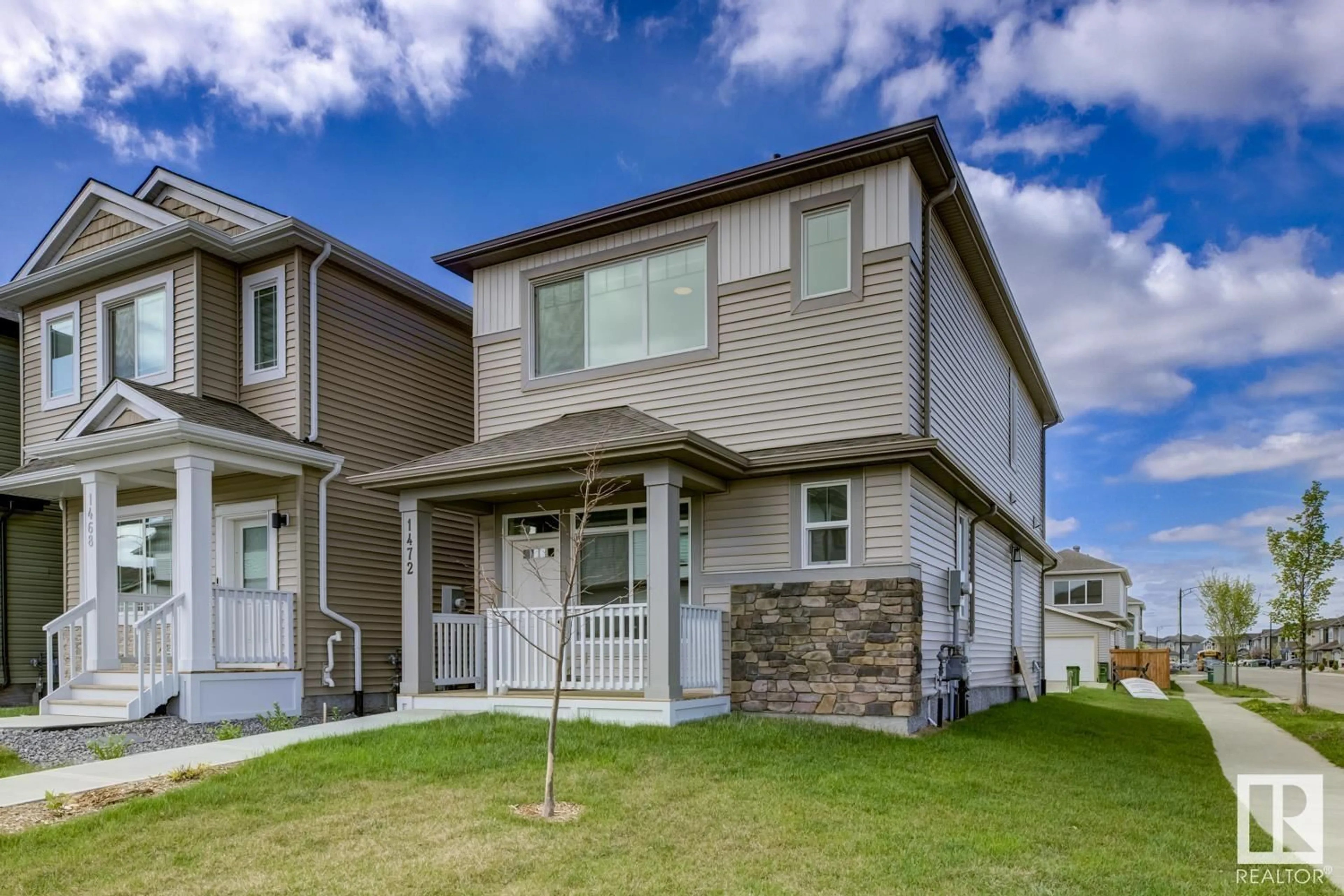 Home with vinyl exterior material, street for NW - 1472 22 ST, Edmonton Alberta T6T2R4