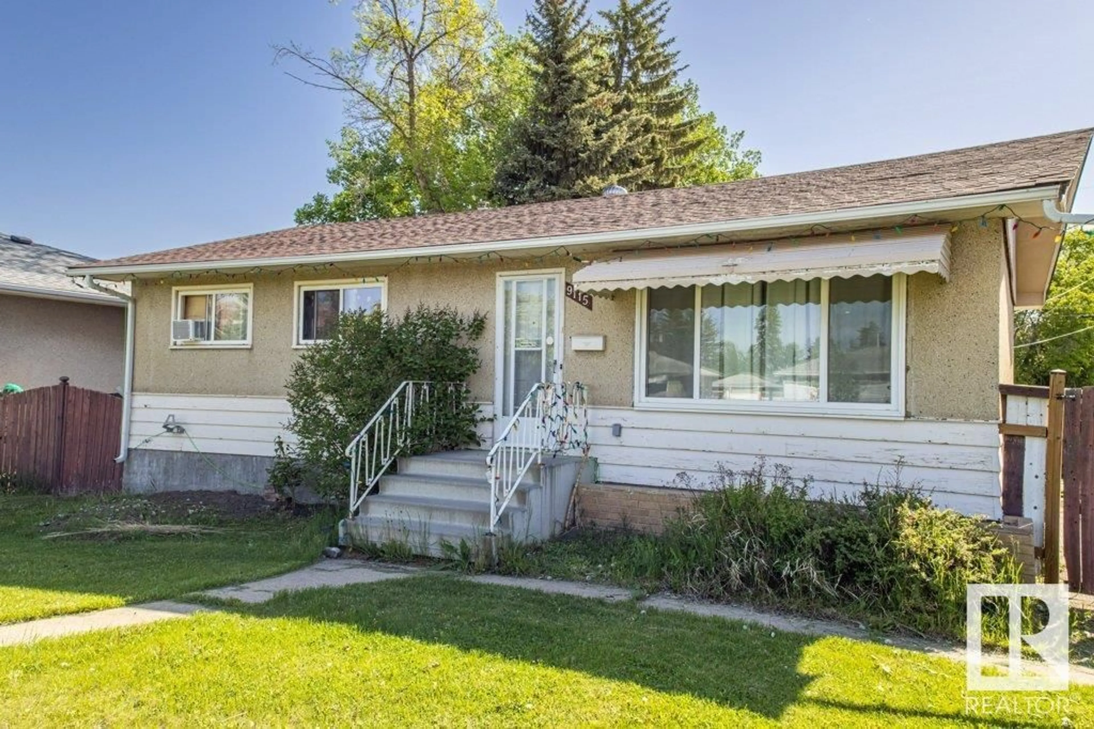 Home with vinyl exterior material, street for NW - 9115 156 ST, Edmonton Alberta T5R1Y9