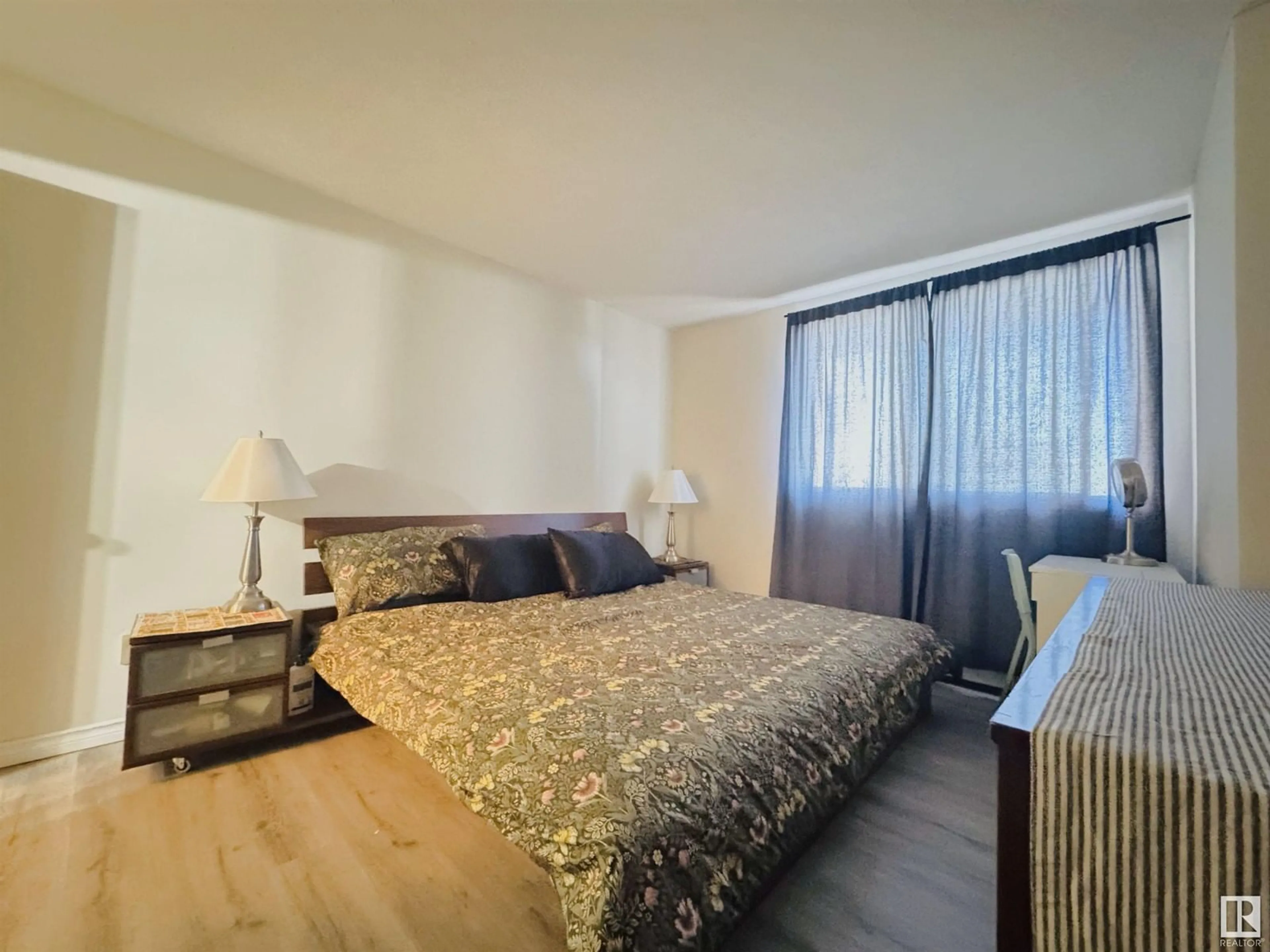Bedroom with bed, wood/laminate floor for 207 - 9028 JASPER AV, Edmonton Alberta T5H3Y6