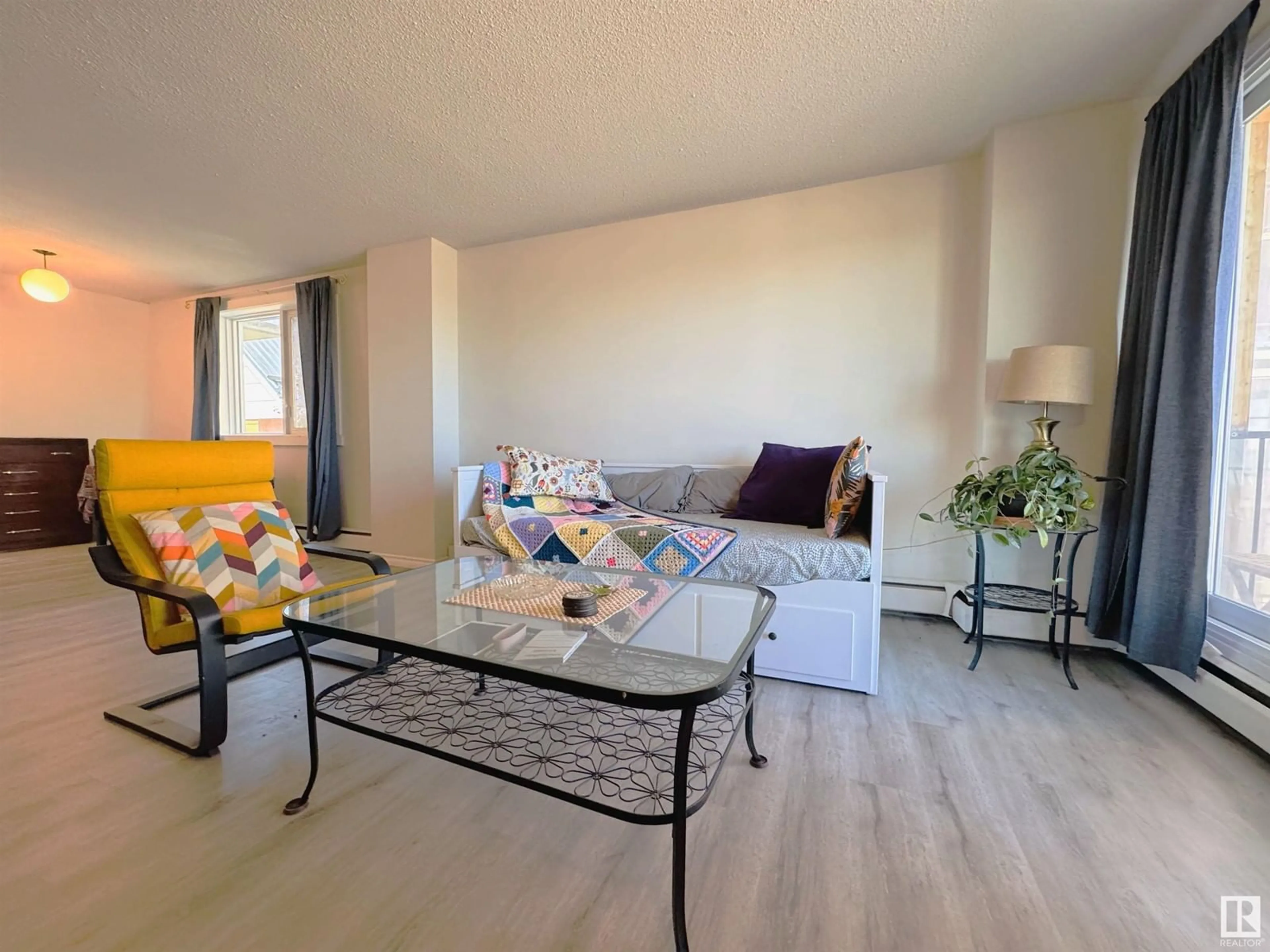 Living room with furniture, unknown for 207 - 9028 JASPER AV, Edmonton Alberta T5H3Y6
