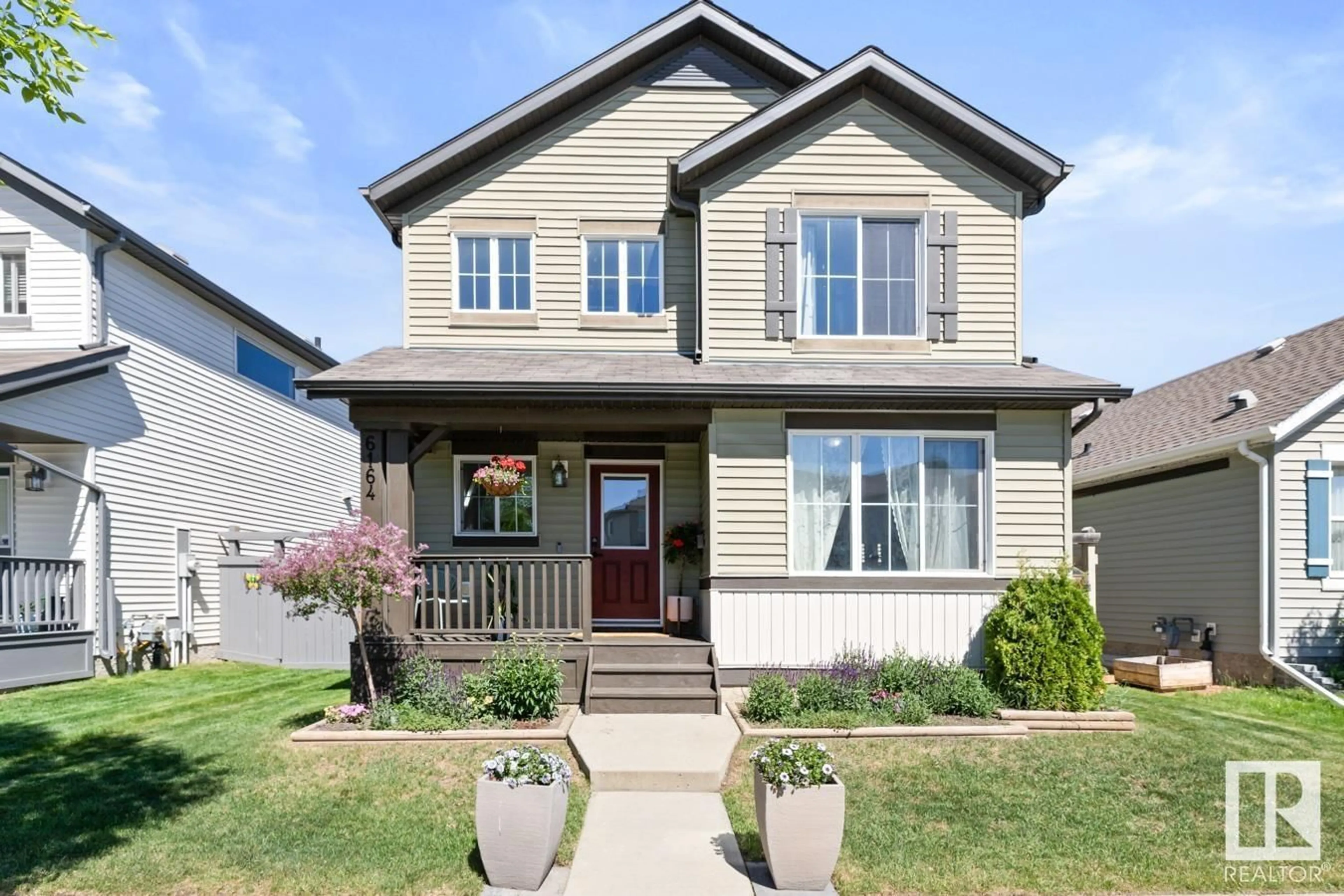 Home with vinyl exterior material, street for 6164 17 AV, Edmonton Alberta T6X0W1