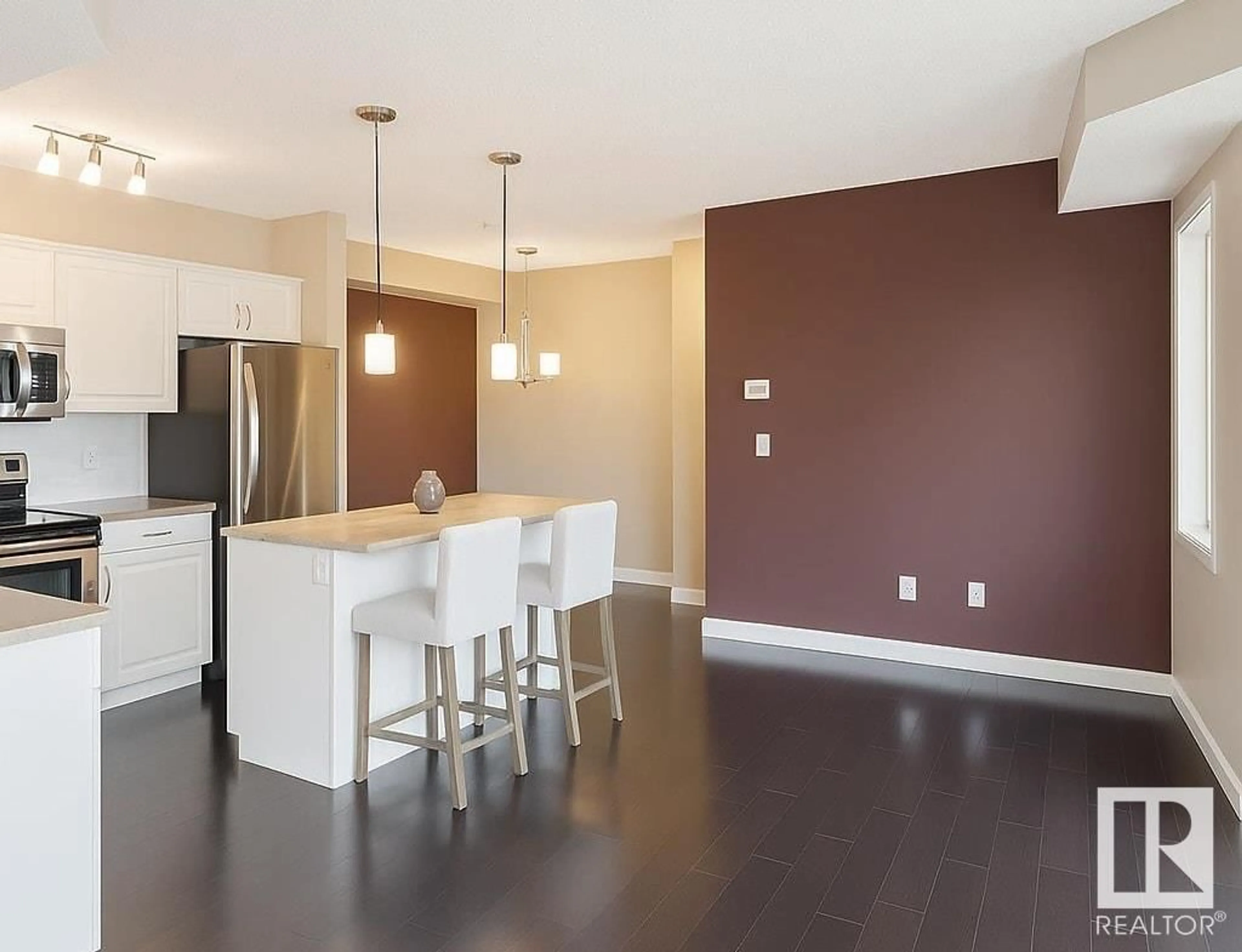 Open concept kitchen, wood/laminate floor for #101 - 8730 82 AV, Edmonton Alberta T6C0Z1