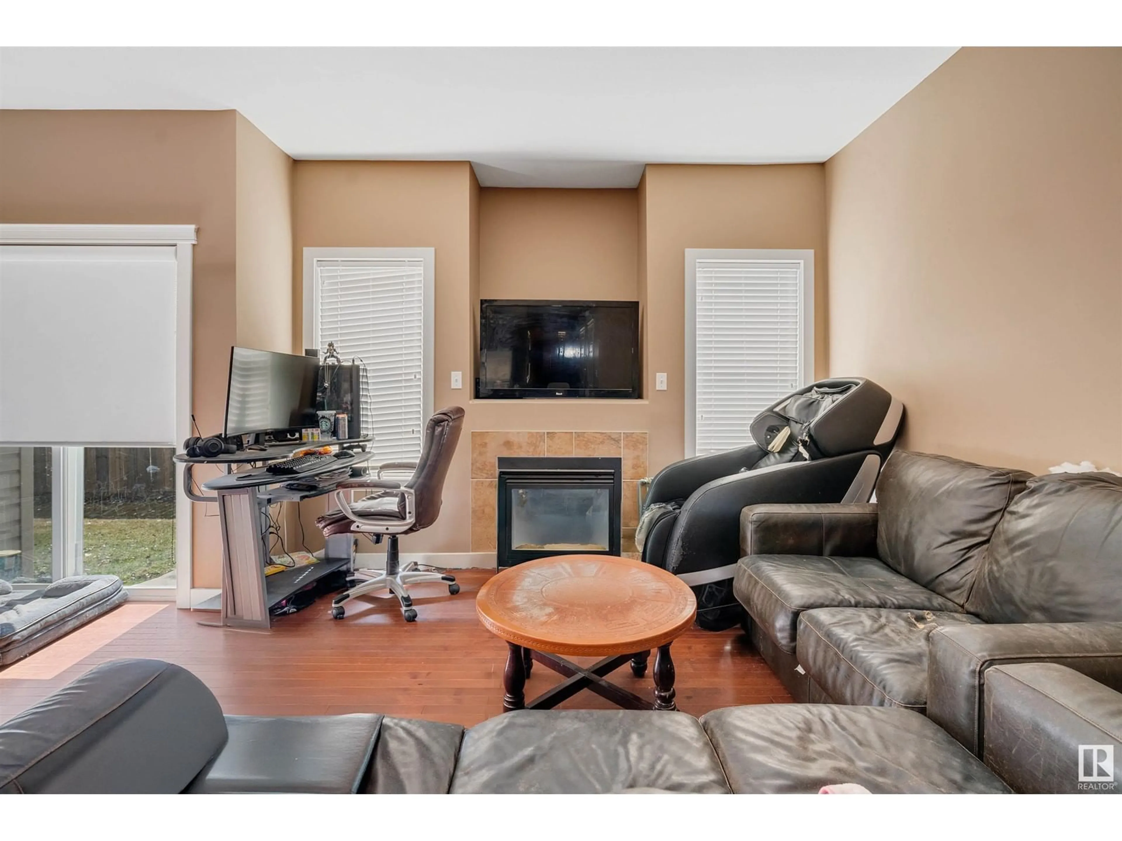 Living room with furniture, wood/laminate floor for 109 SANDSTONE ES, Stony Plain Alberta T7Z0E2