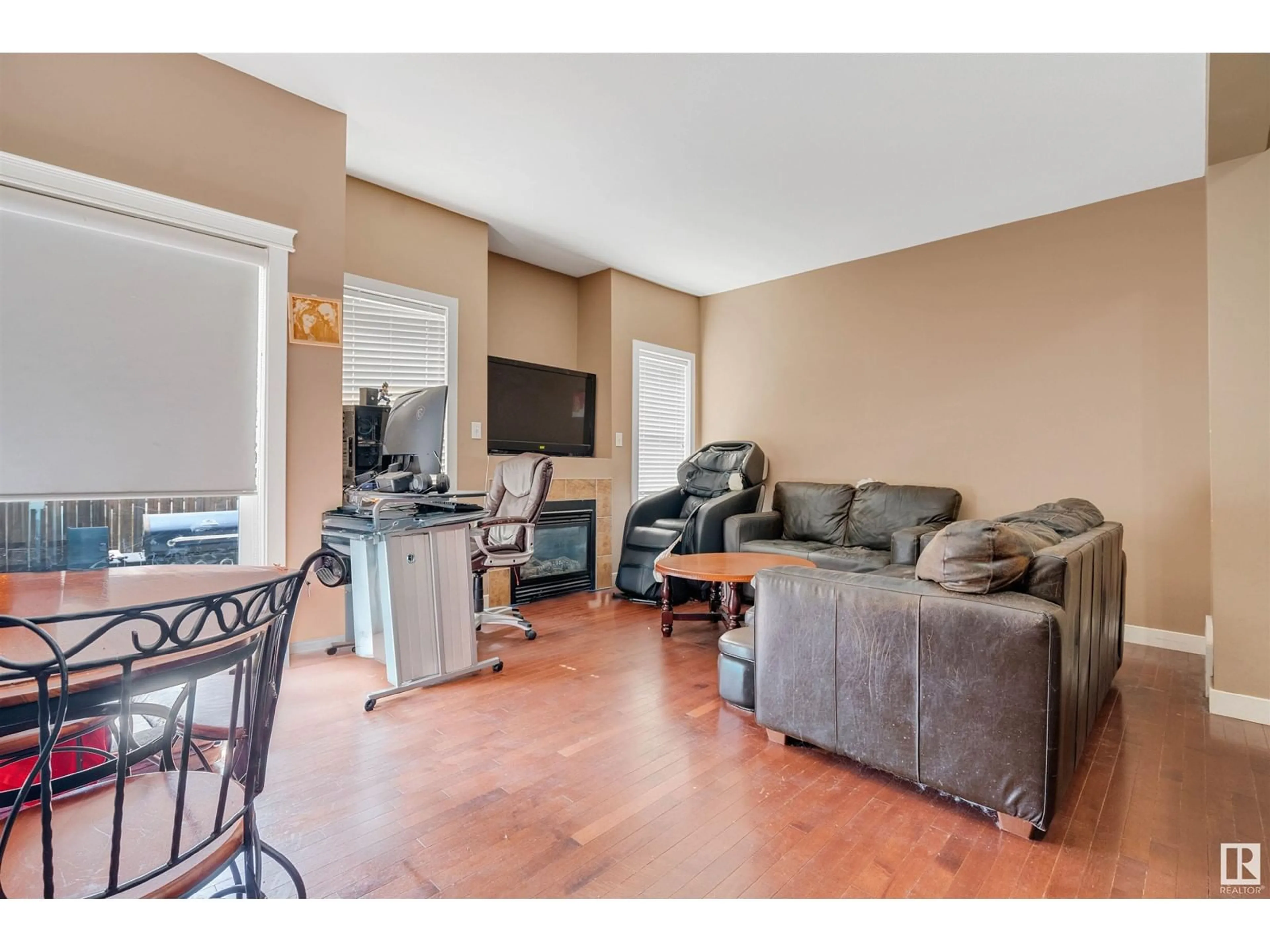 Living room with furniture, wood/laminate floor for 109 SANDSTONE ES, Stony Plain Alberta T7Z0E2