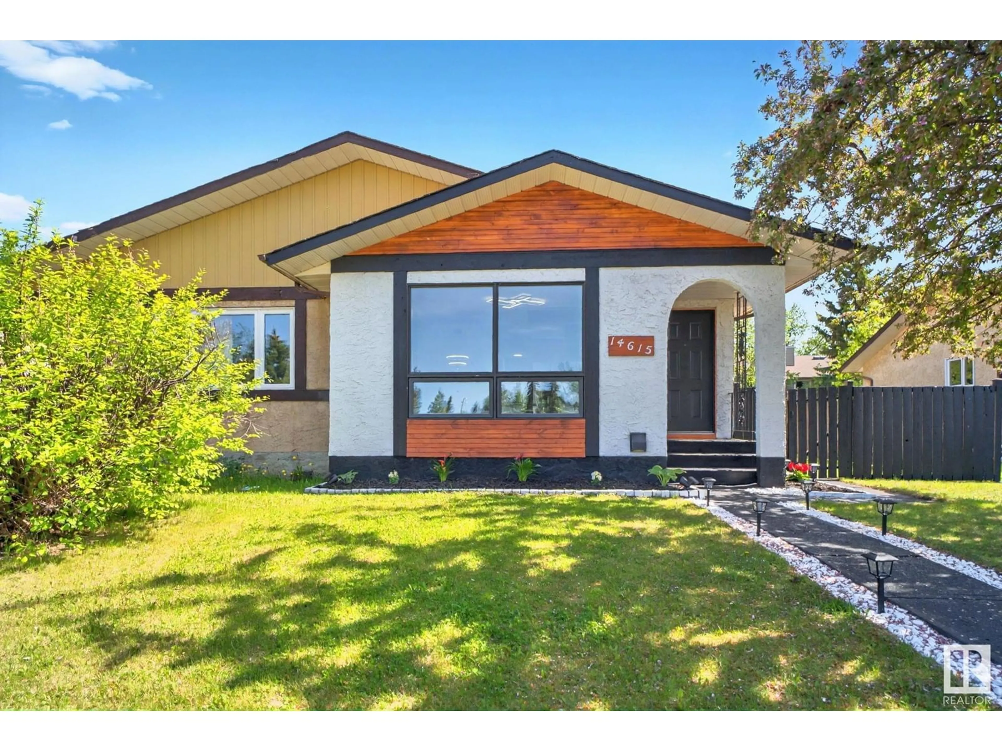 Home with vinyl exterior material, street for 14615 21 ST, Edmonton Alberta T5Y1V8