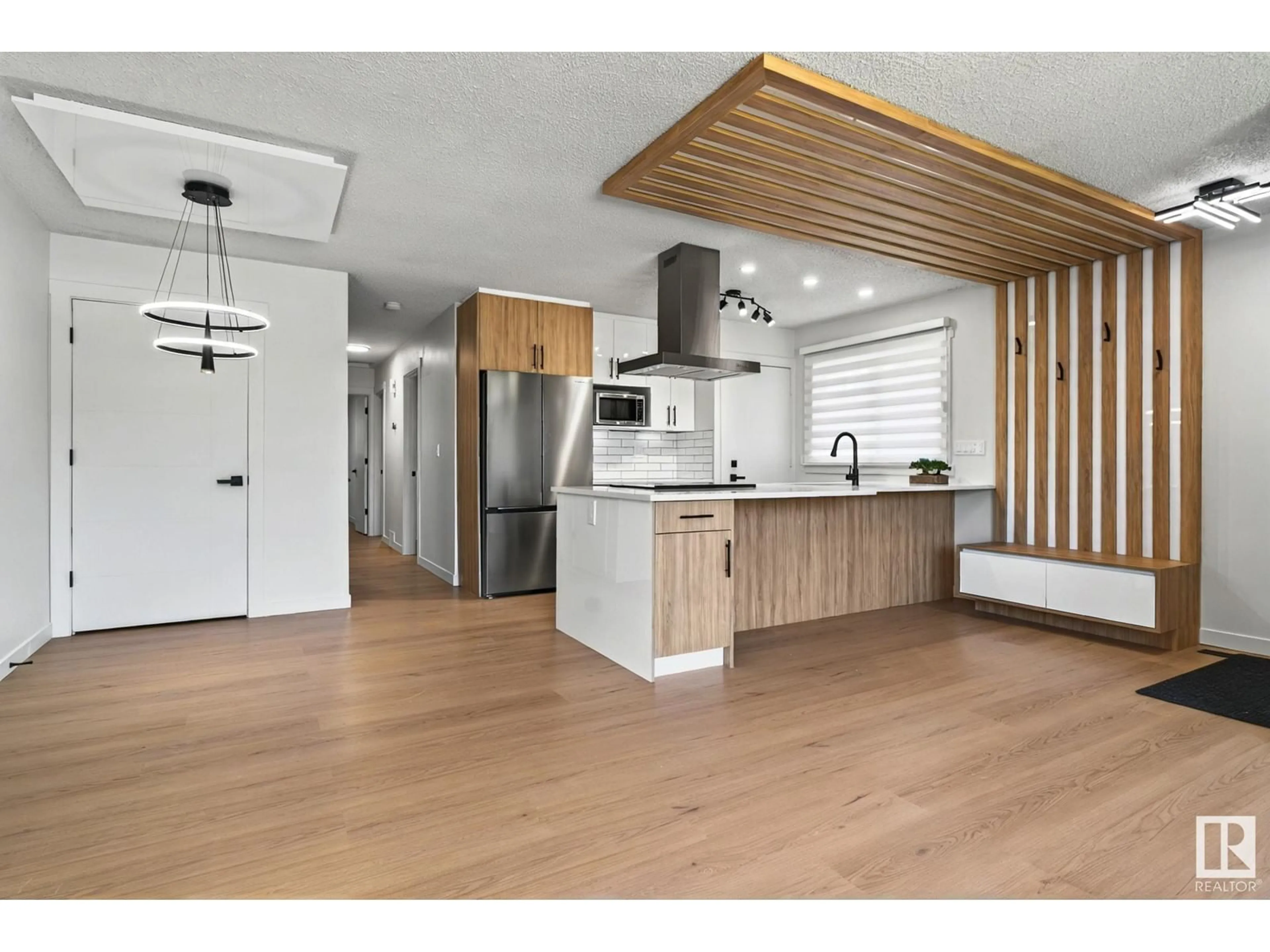 Open concept kitchen, wood/laminate floor for 14615 21 ST, Edmonton Alberta T5Y1V8