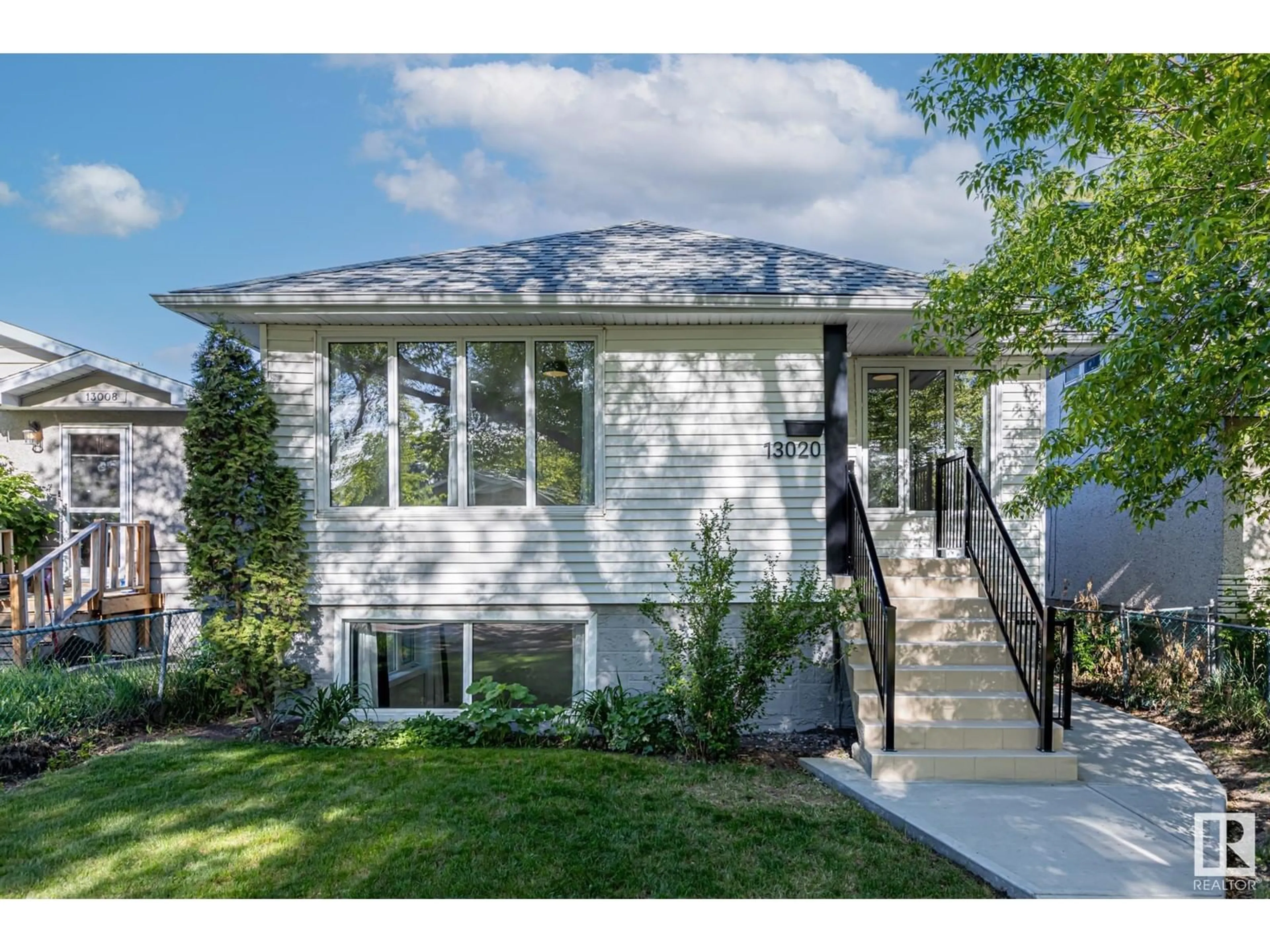 Home with vinyl exterior material, street for NW - 13020 65 ST, Edmonton Alberta T5A1A1