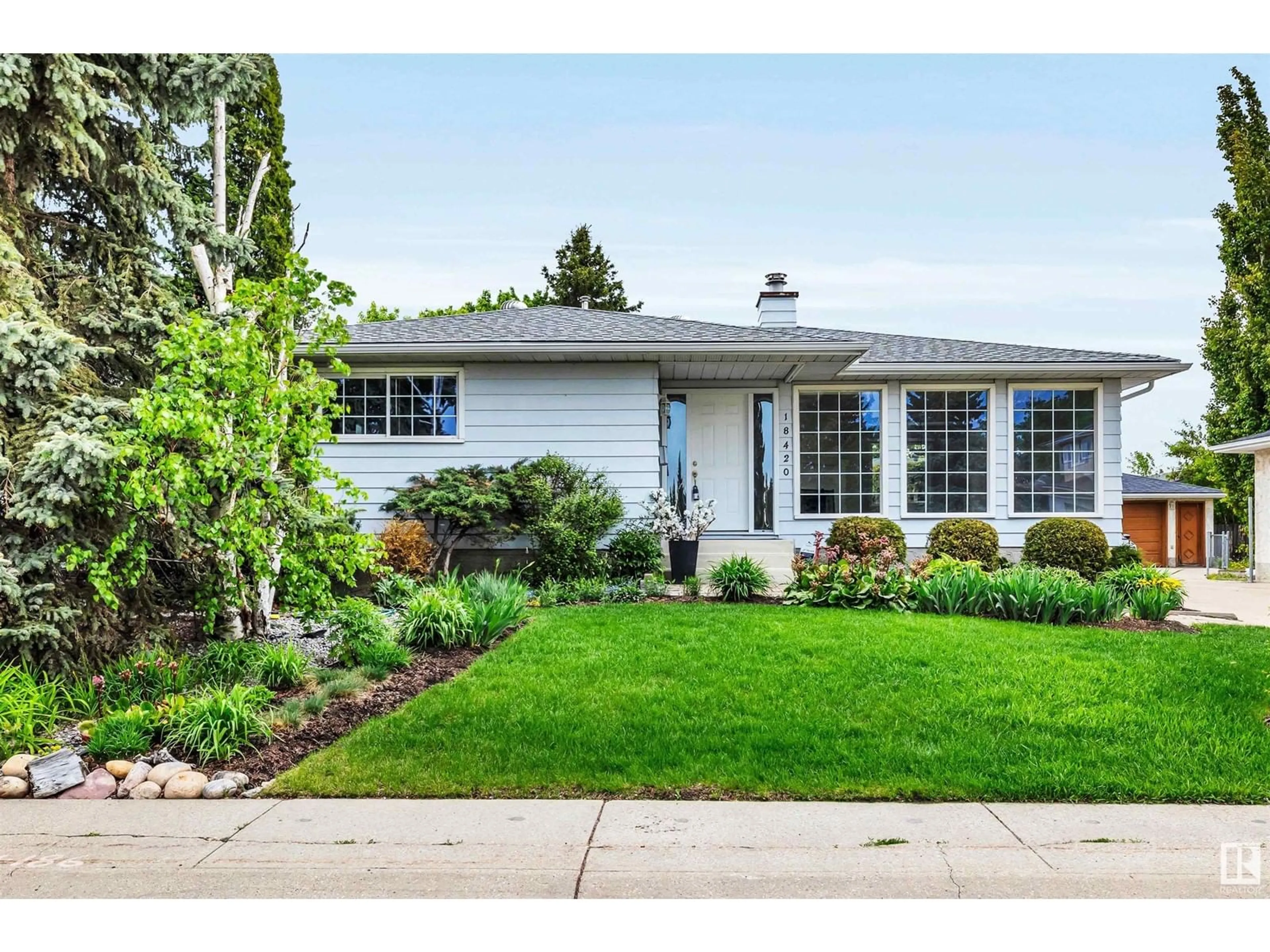 Home with vinyl exterior material, street for 18420 89 AV, Edmonton Alberta T5T1N5
