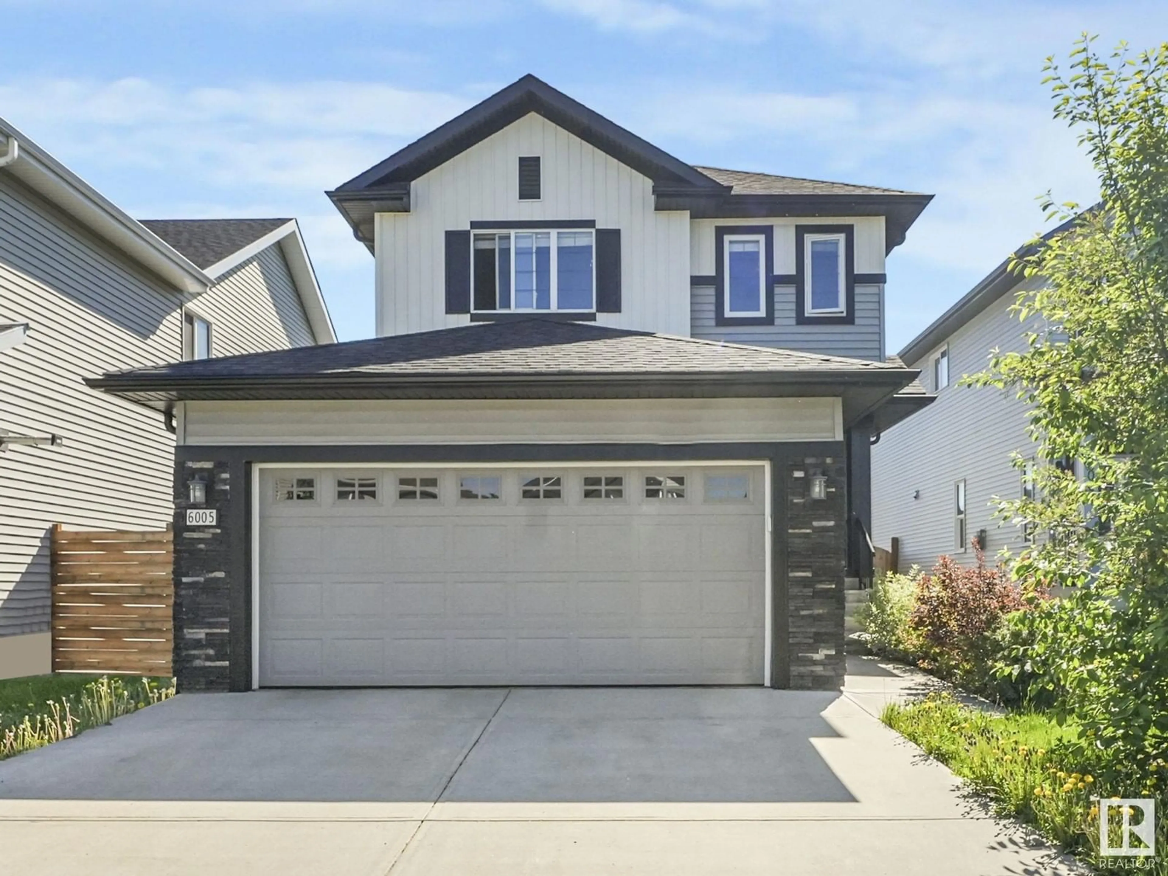 Home with vinyl exterior material, street for 6005 64 ST, Beaumont Alberta T4X1Z2