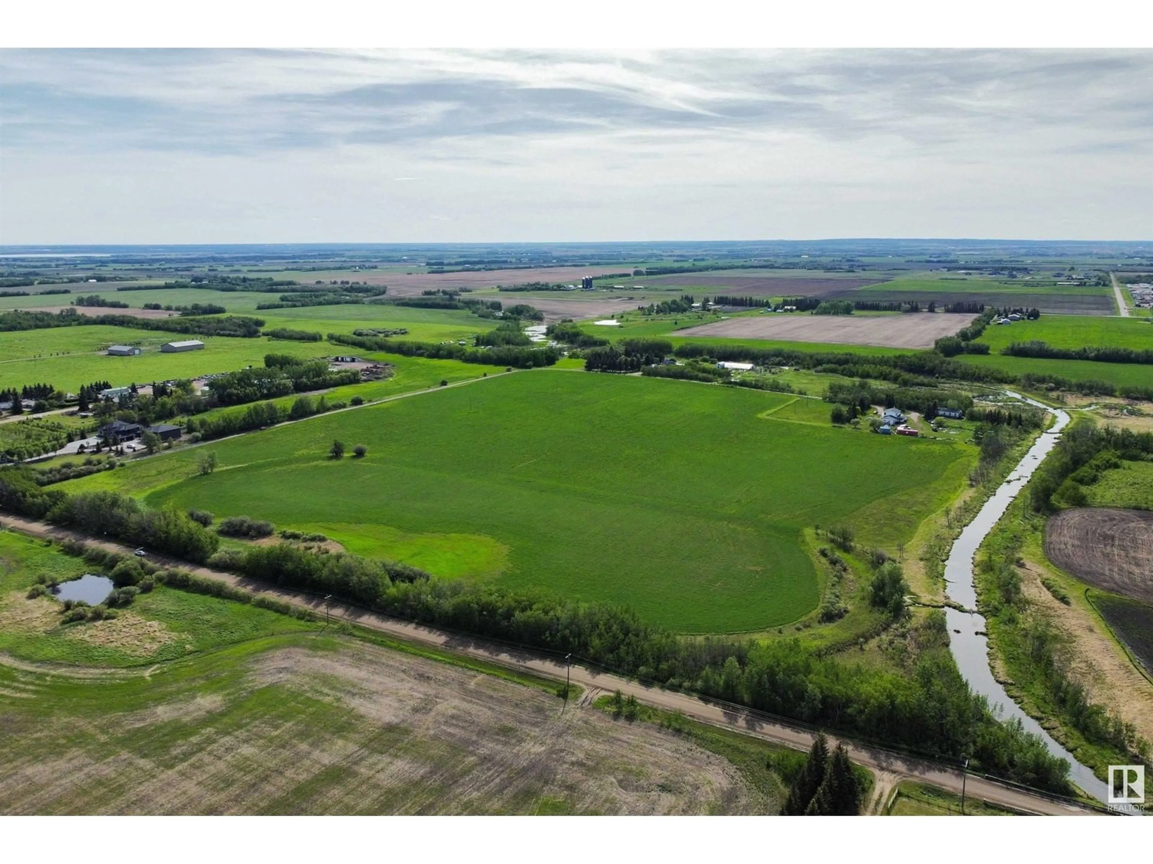 A pic from outside/outdoor area/front of a property/back of a property/a pic from drone, water/lake/river/ocean view for 54318 RGE RD 255, St. Albert Alberta T8T0T8