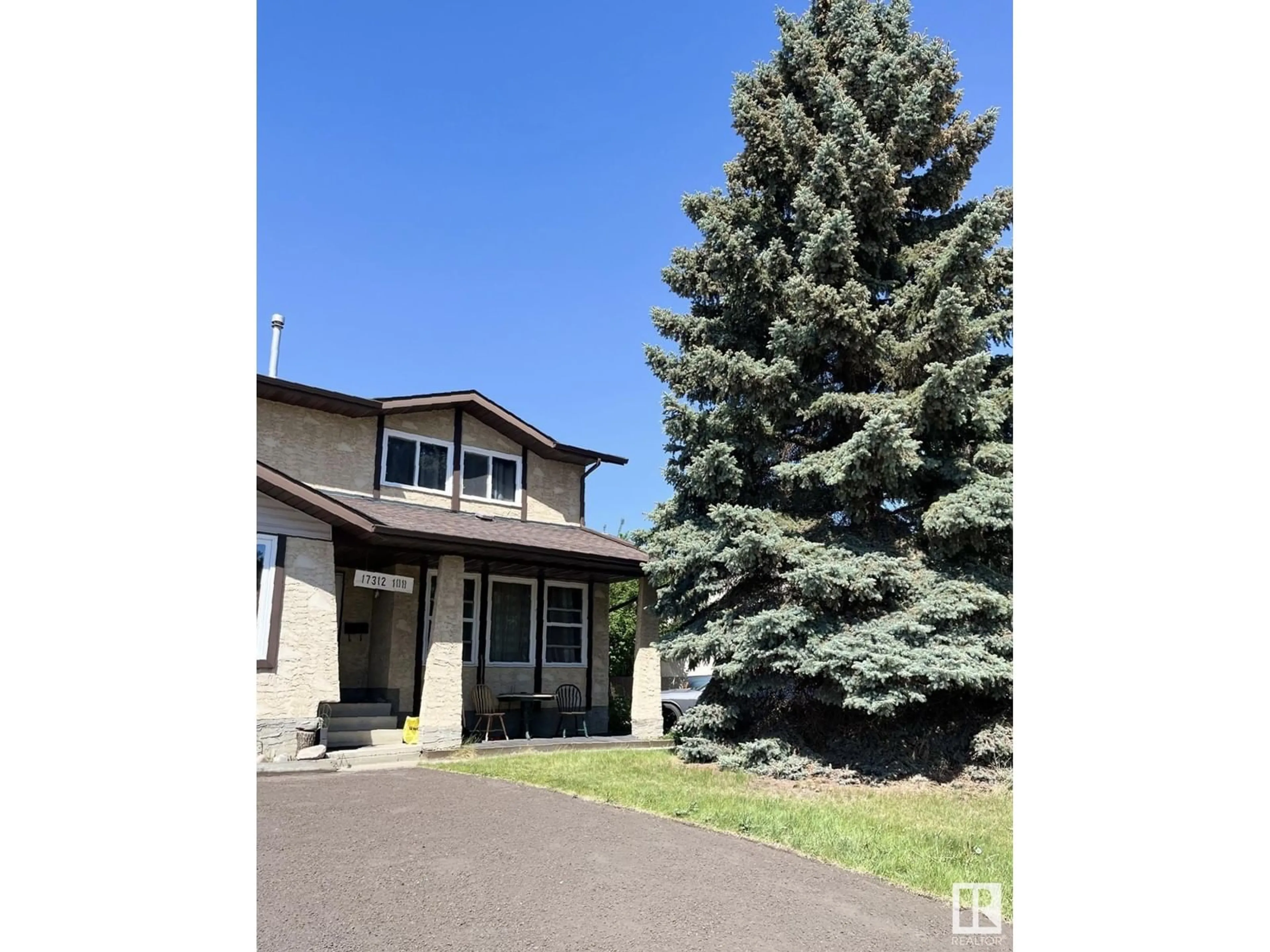 Home with vinyl exterior material, street for 17312 108 ST, Edmonton Alberta T5X3Y8