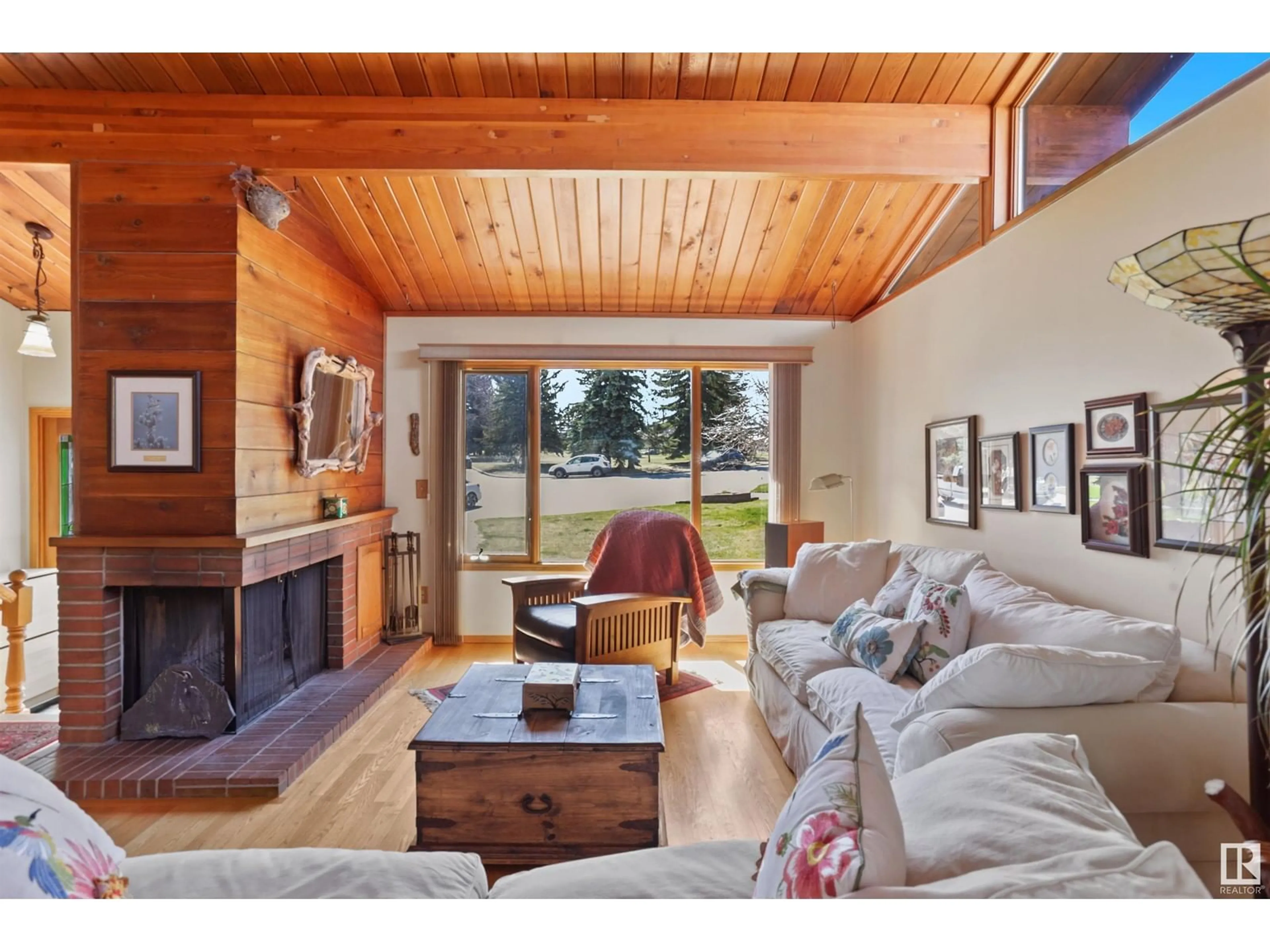 Living room with furniture, wood/laminate floor for 17 CLEARWATER CR, Devon Alberta T9G1C8